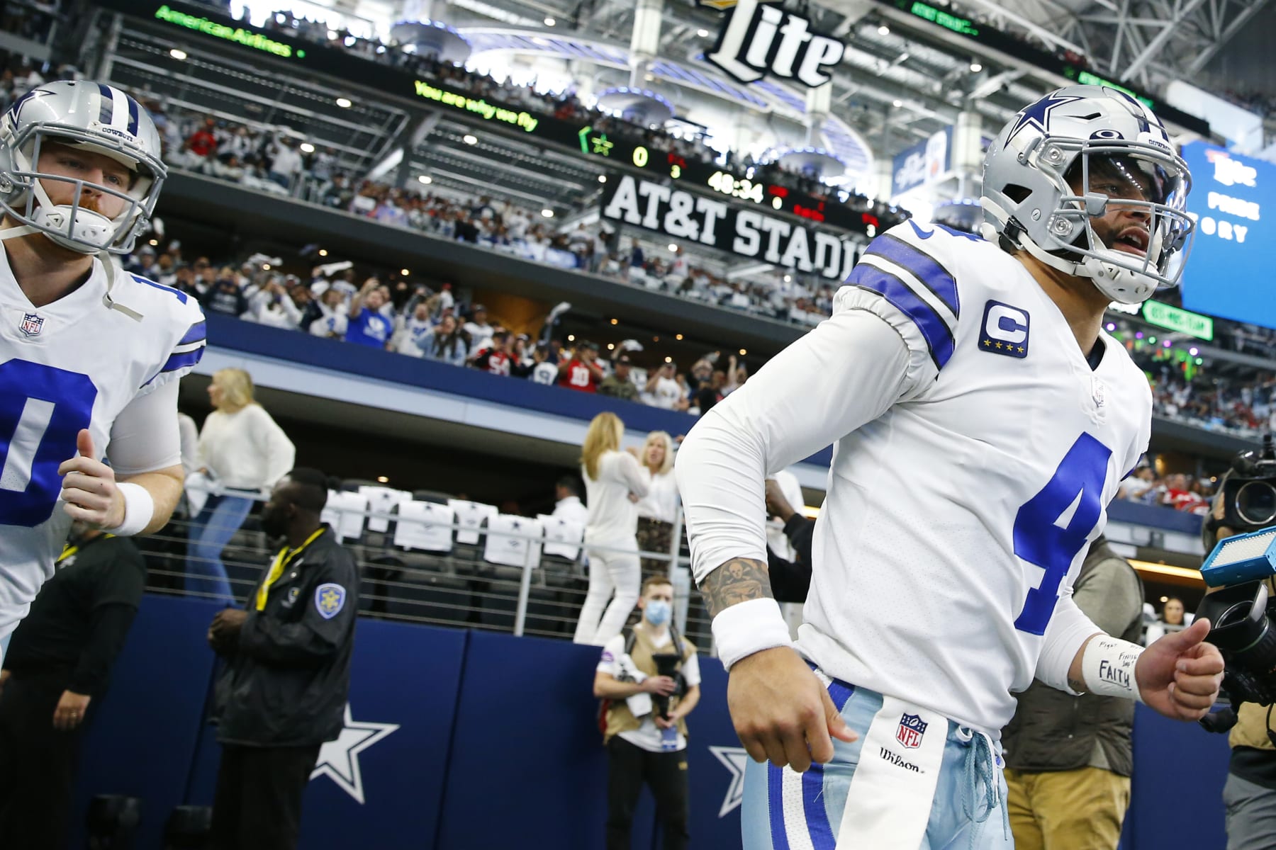 ARLINGTON, TEXAS - JANUARY 16: Cooper Rush #10 and Dak Prescott #4 of the Dallas Cowboys take the field prior to a game against the San Francisco 49ers in the NFC Wild Card Playoff game at AT&T Stadium on January 16, 2022 in Arlington, Texas. (Photo by Richard Rodriguez/Getty Images)