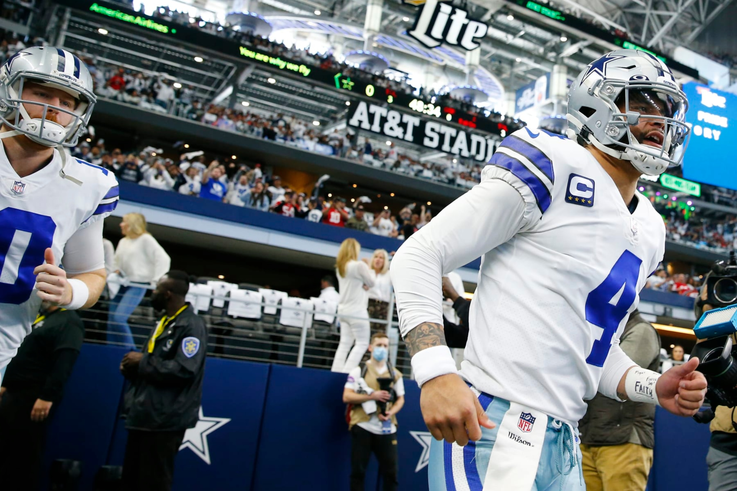 ARLINGTON, TEXAS - JANUARY 16: Cooper Rush #10 and Dak Prescott #4 of the Dallas Cowboys take the field prior to a game against the San Francisco 49ers in the NFC Wild Card Playoff game at AT&T Stadium on January 16, 2022 in Arlington, Texas. (Photo by Richard Rodriguez/Getty Images)