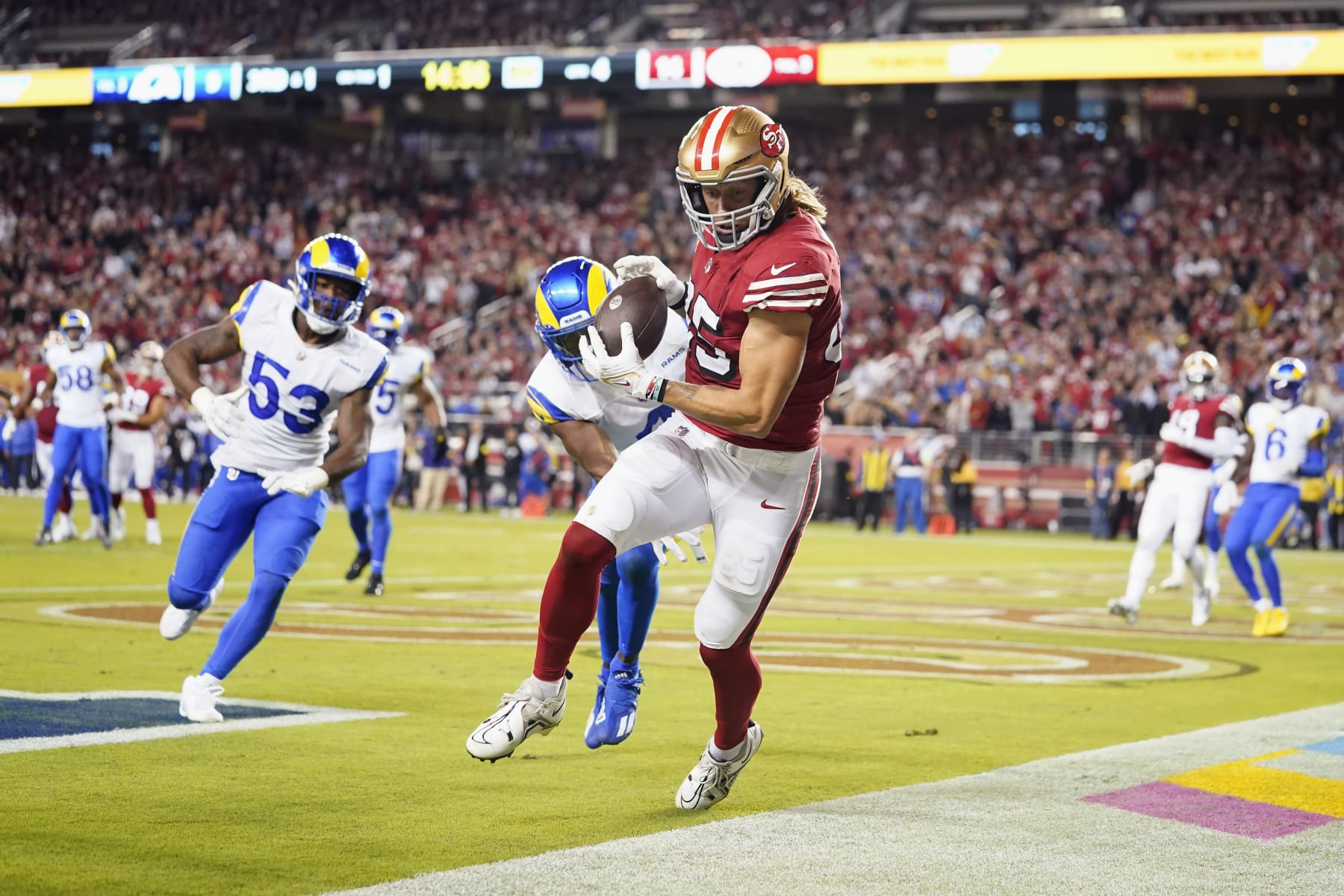 San Francisco 49ers tight end George Kittle, middle, cannot catch a pass in bounds during the second half of an NFL football game against the Los Angeles Rams in Santa Clara, Calif., Monday, Oct. 3, 2022. (AP Photo/Godofredo A. Vásquez)