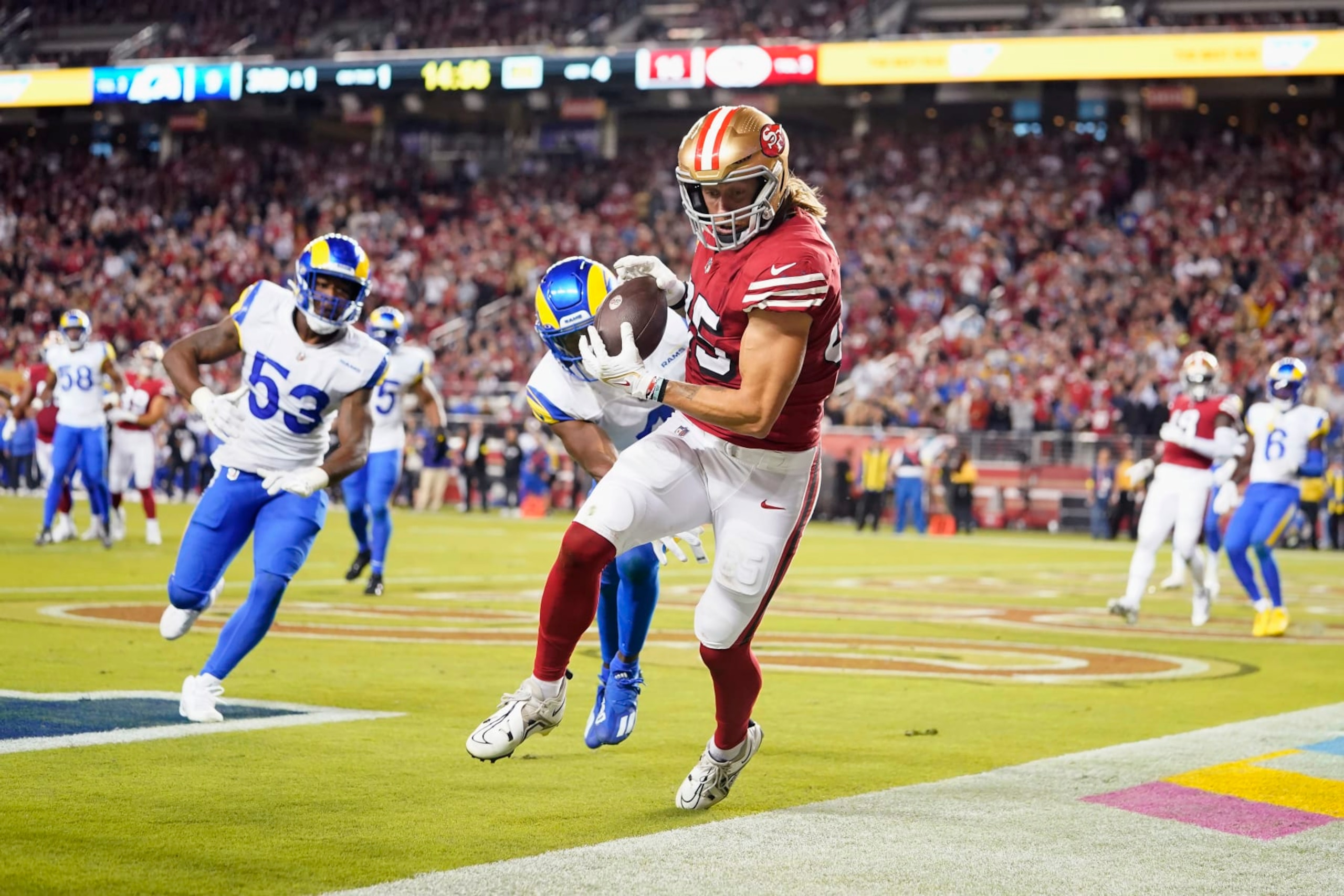 San Francisco 49ers tight end George Kittle, middle, cannot catch a pass in bounds during the second half of an NFL football game against the Los Angeles Rams in Santa Clara, Calif., Monday, Oct. 3, 2022. (AP Photo/Godofredo A. Vásquez)