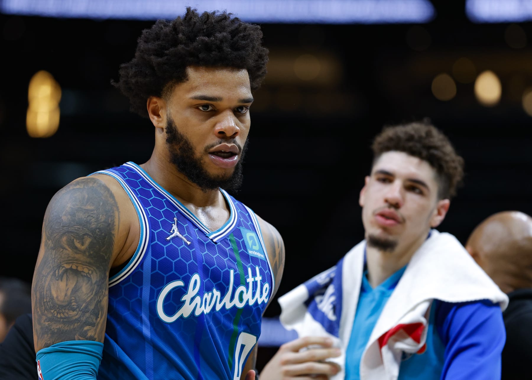 ATLANTA, GA - APRIL 13: Miles Bridges #0 of the Charlotte Hornets is restrained after being ejected from the game during the second half against the Atlanta Hawks at State Farm Arena on April 13, 2022 in Atlanta, Georgia. NOTE TO USER: User expressly acknowledges and agrees that, by downloading and or using this photograph, User is consenting to the terms and conditions of the Getty Images License Agreement. (Photo by Todd Kirkland/Getty Images)