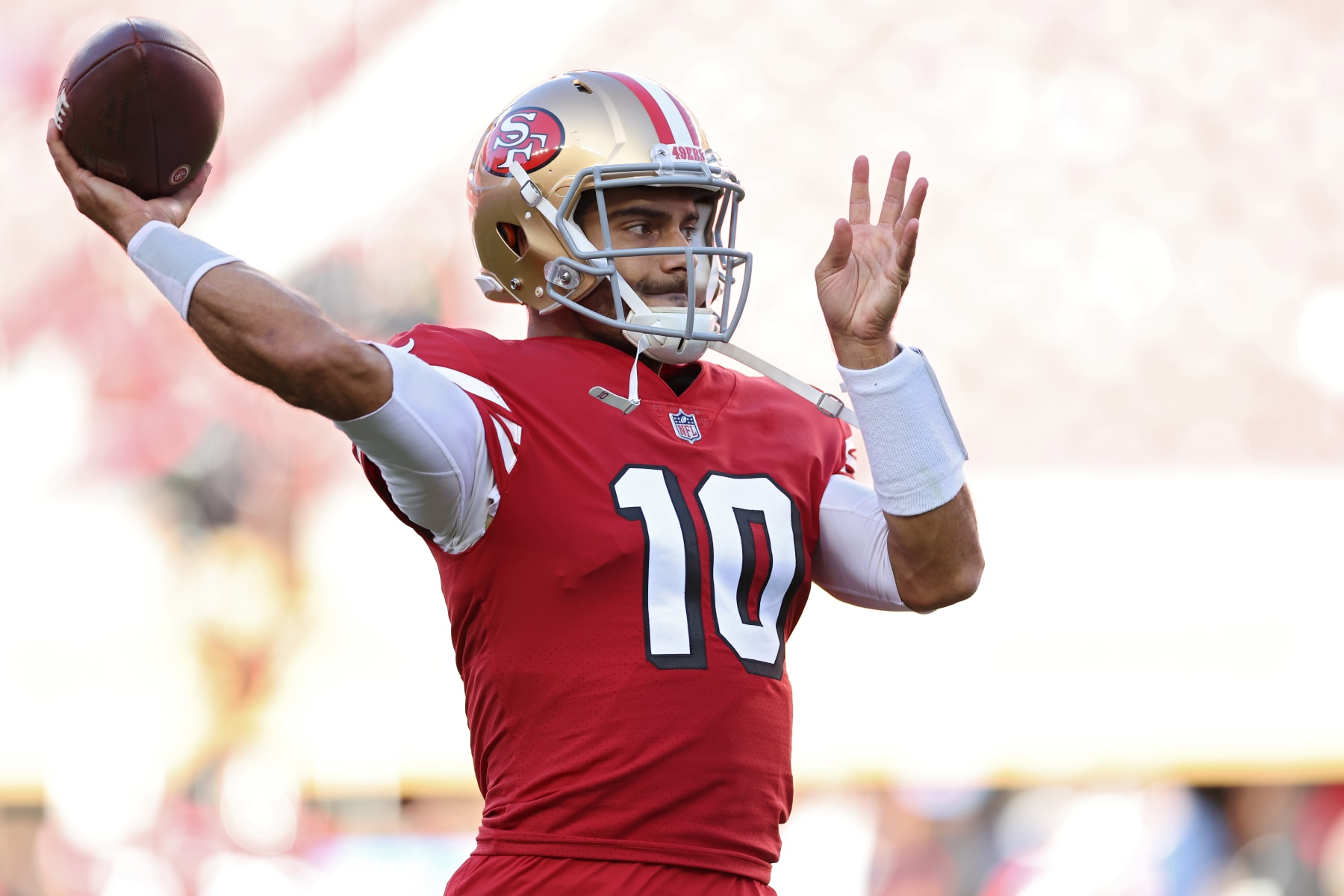 SANTA CLARA, CALIFORNIA - OCTOBER 03: Quarterback Jimmy Garoppolo #10 of the San Francisco 49ers throws a pass as he warms up before playing against the Los Angeles Rams at Levi's Stadium on October 03, 2022 in Santa Clara, California. (Photo by Ezra Shaw/Getty Images)
