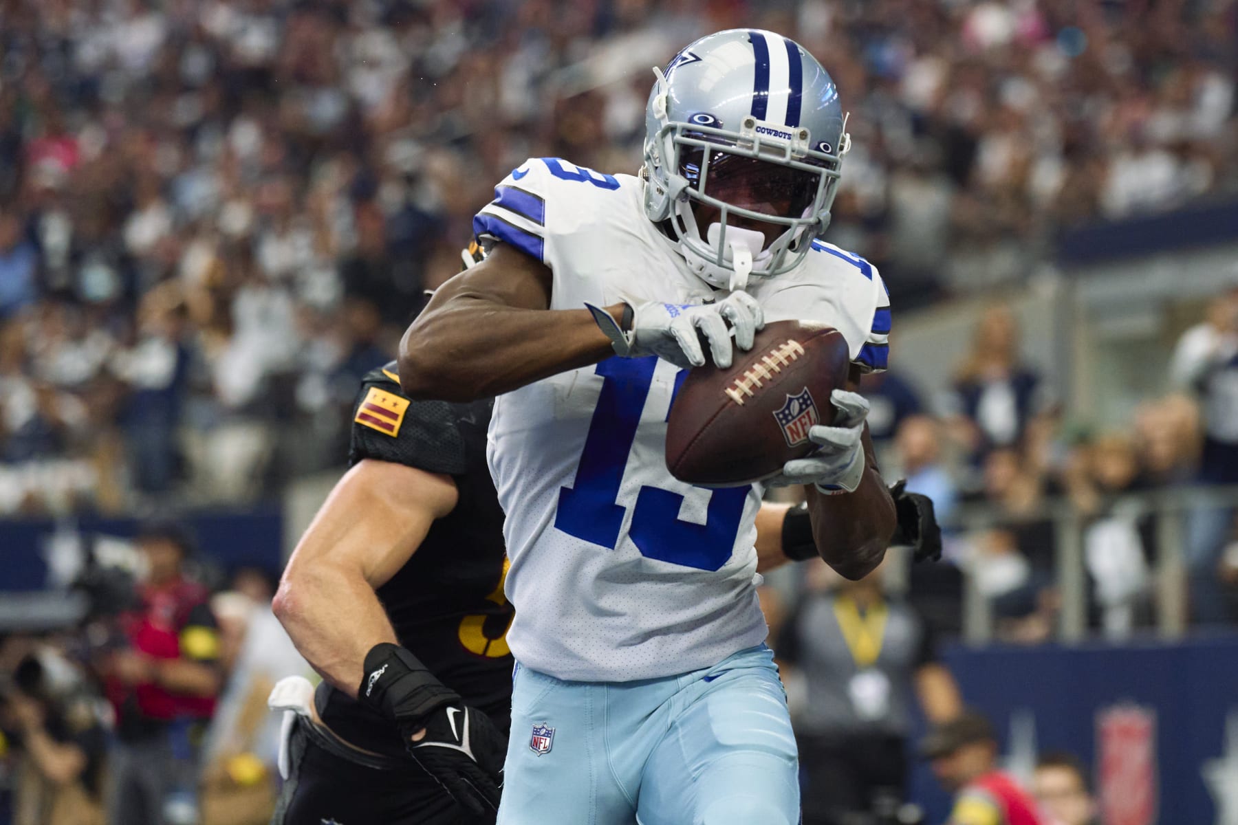 ARLINGTON, TX - OCTOBER 02: Michael Gallup #13 of the Dallas Cowboys catches a touchdown pass against the Washington Commanders at AT&T Stadium on October 2, 2022 in Arlington, Texas. (Photo by Cooper Neill/Getty Images)