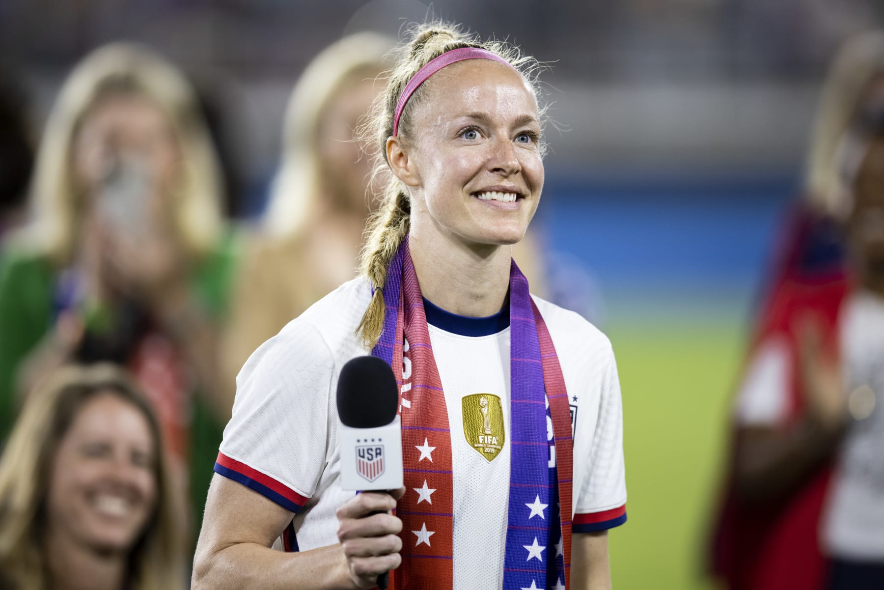 WASHINGTON, DC - SEPTEMBER 06: Becky Sauerbrunn #4 of United States wears an Equal Pay scarf and takes in the applause for her role in the negotiations that brought about the signing of a collective bargaining agreement signifying equal pay between the men's and women's national soccer teams at Audi Field on September 06, 2022 in Washington, DC (Photo by Ira L. Black - Corbis/Getty Images)