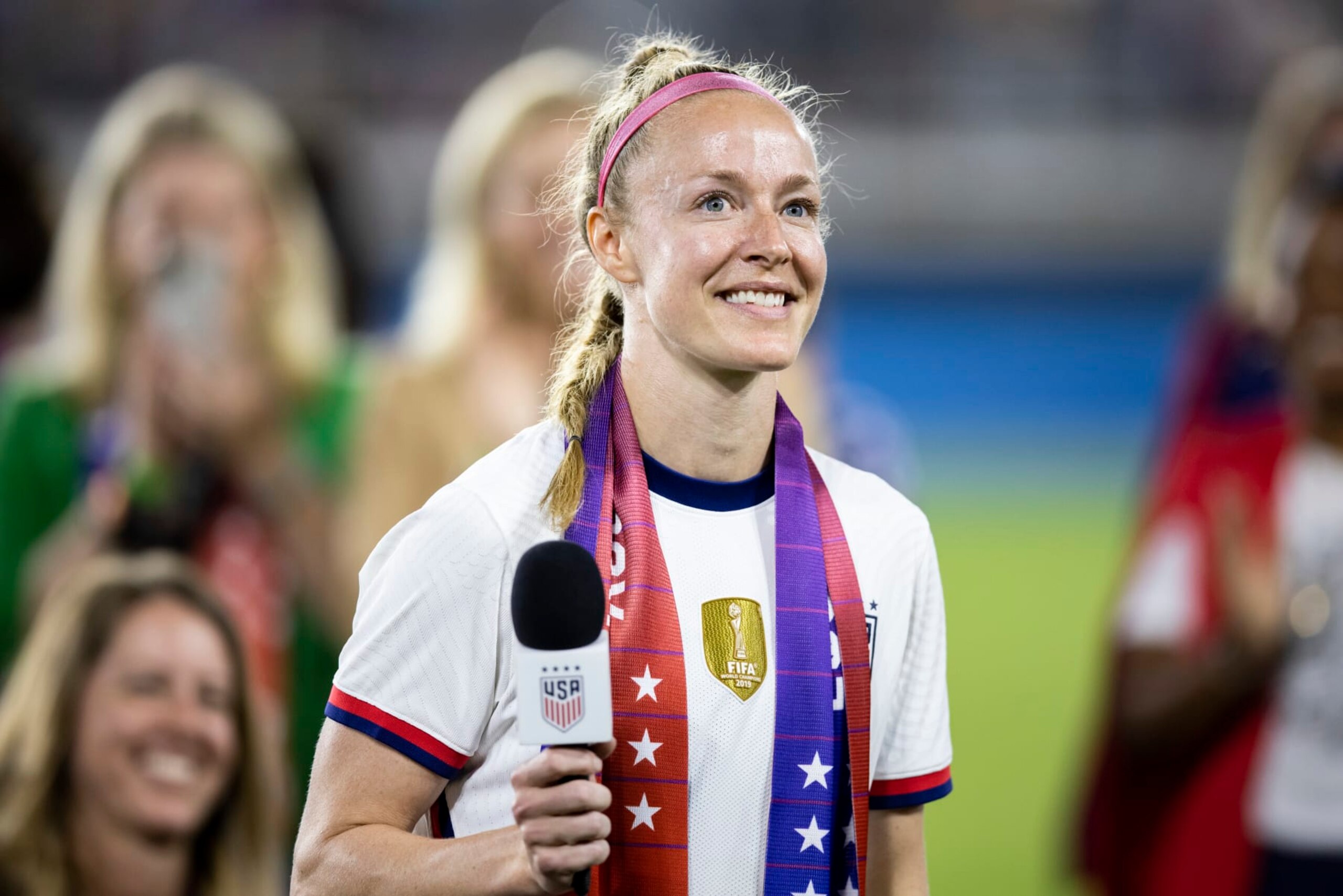 WASHINGTON, DC - SEPTEMBER 06: Becky Sauerbrunn #4 of United States wears an Equal Pay scarf and takes in the applause for her role in the negotiations that brought about the signing of a collective bargaining agreement signifying equal pay between the men's and women's national soccer teams at Audi Field on September 06, 2022 in Washington, DC (Photo by Ira L. Black - Corbis/Getty Images)