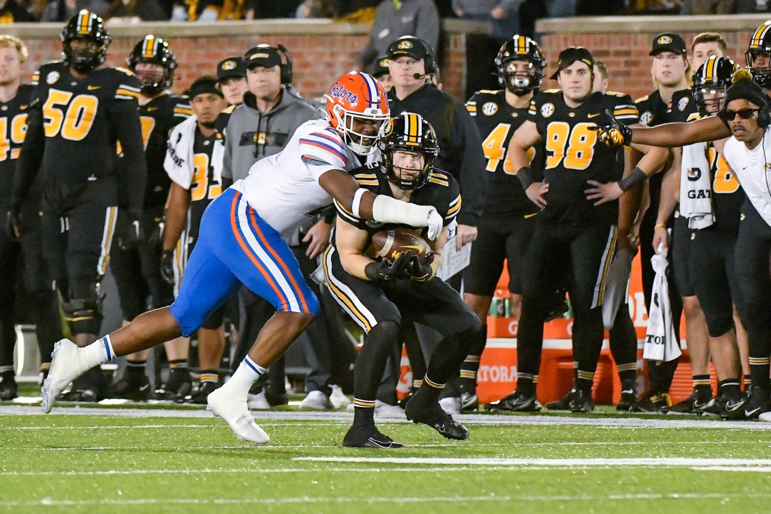 COLUMBIA, MO - NOVEMBER 20: Missouri Tigers wide receiver Barrett Banister (11) makes the catch despite the defense of Florida Gators linebacker Amari Burney (2) during a game between the Florida Gators and the Missouri Tigers on November 20, 2021, at Faurot Field at Memorial Stadium in Columbia MO (Photo by Rick Ulreich/Icon Sportswire via Getty Images)
