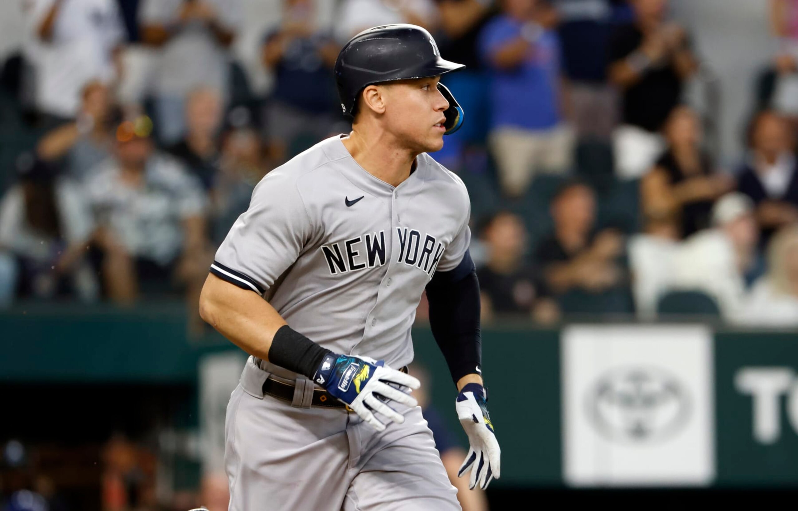 ARLINGTON, TX - OCTOBER 4: Aaron Judge #99 of the New York Yankees runs toward first base after flying out against the Texas Rangers during the first inning in game one of a double header at Globe Life Field on October 4, 2022 in Arlington, Texas. (Photo by Ron Jenkins/Getty Images)