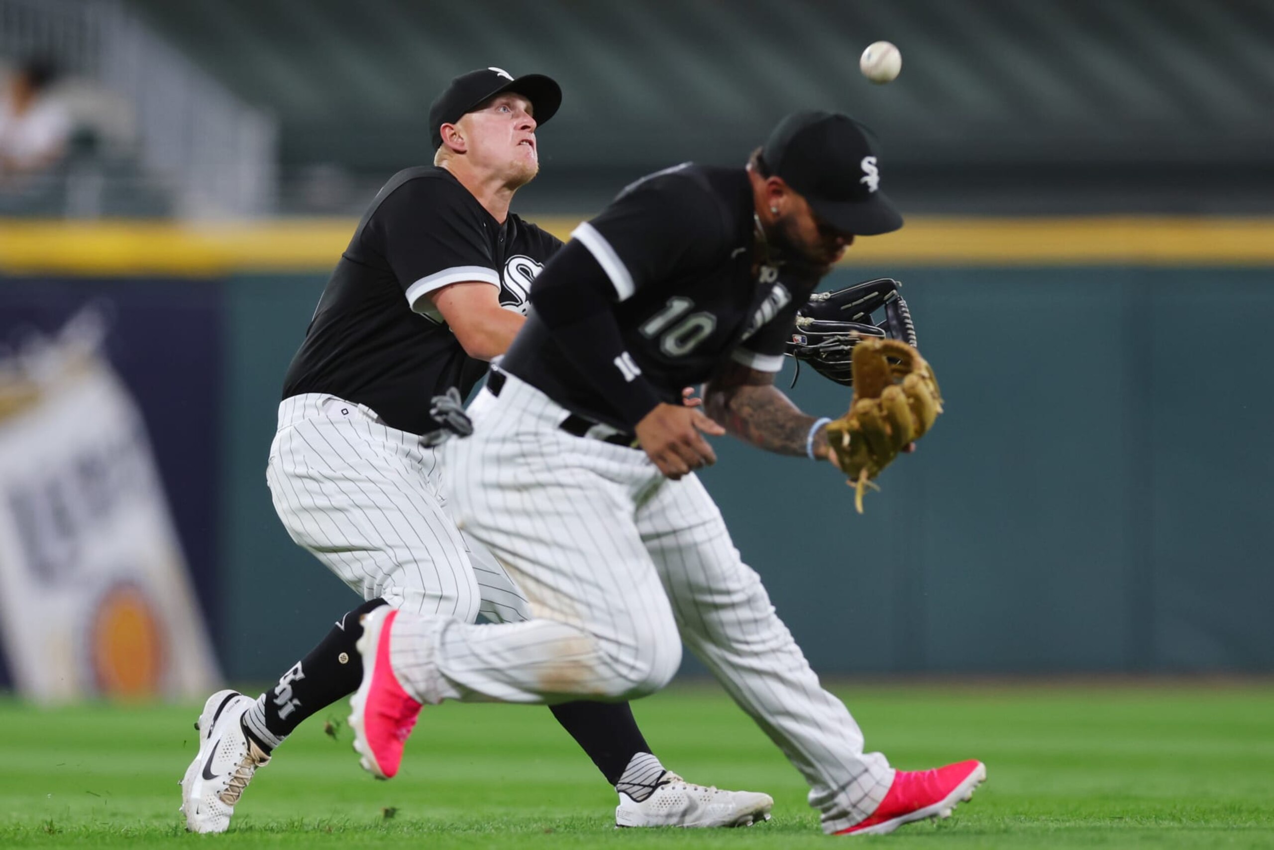 CHICAGO, ILLINOIS - SEPTEMBER 21: Andrew Vaughn #25 and Yoan Moncada #10 of the Chicago White Sox collide on a flyball single during the third inning against the Cleveland Guardians at Guaranteed Rate Field on September 21, 2022 in Chicago, Illinois. (Photo by Michael Reaves/Getty Images)