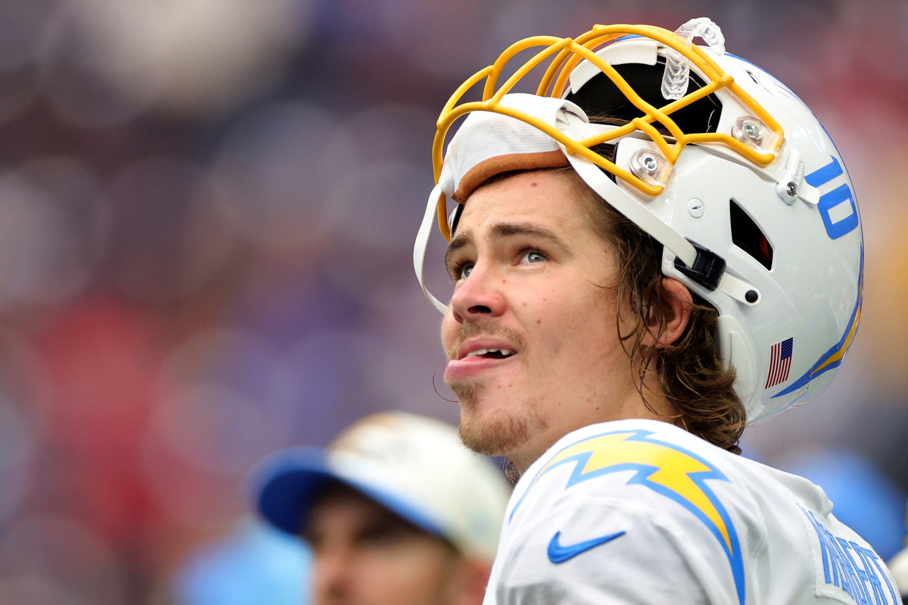HOUSTON, TEXAS - OCTOBER 02: Justin Herbert #10 of the Los Angeles Chargers looks on in the fourth quarter against the Houston Texans at NRG Stadium on October 02, 2022 in Houston, Texas. (Photo by Carmen Mandato/Getty Images)