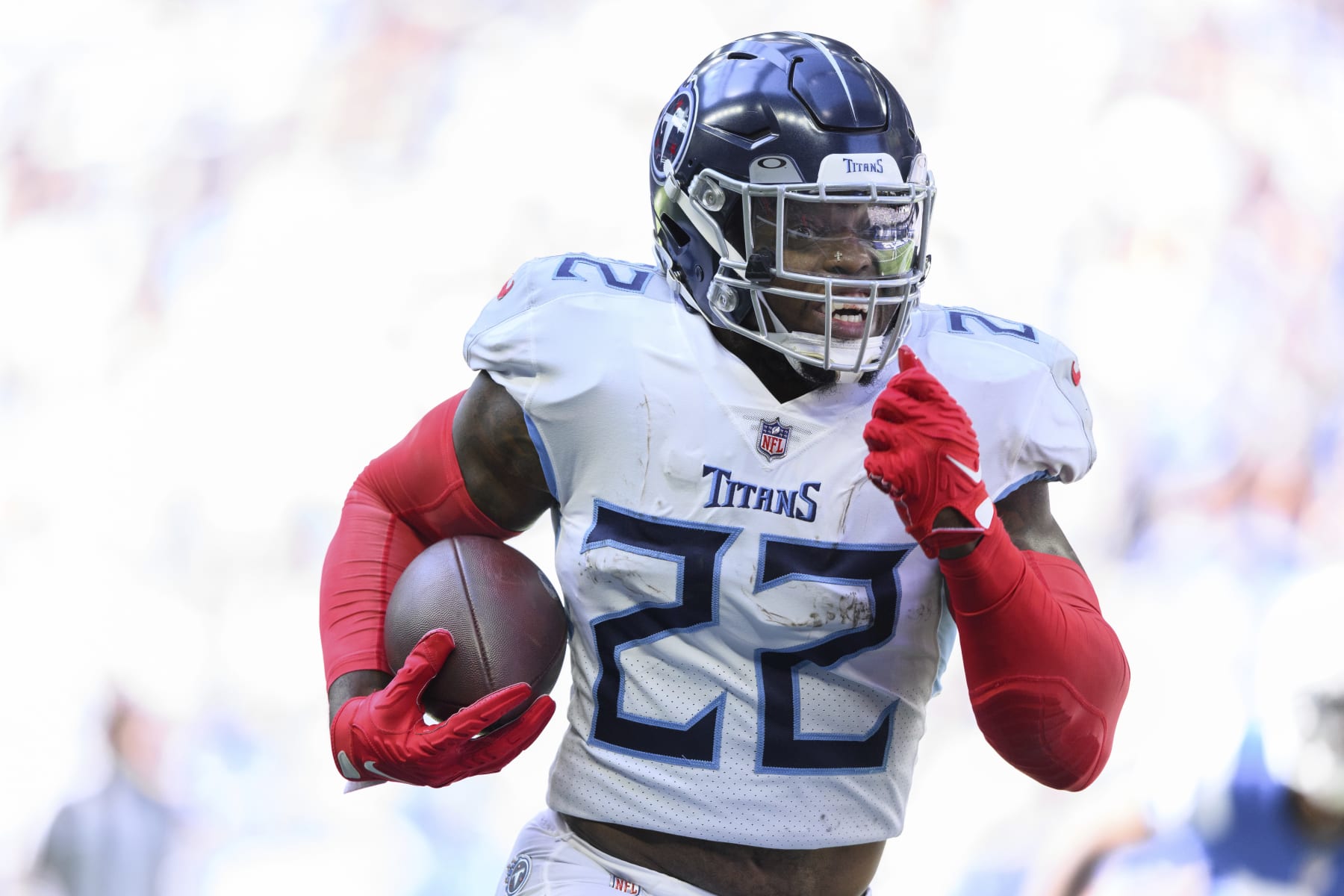 Tennessee Titans running back Derrick Henry (22) takes a handoff to the outside during an NFL football game against the Indianapolis Colts, Sunday, Oct. 2, 2022, in Indianapolis. (AP Photo/Zach Bolinger)