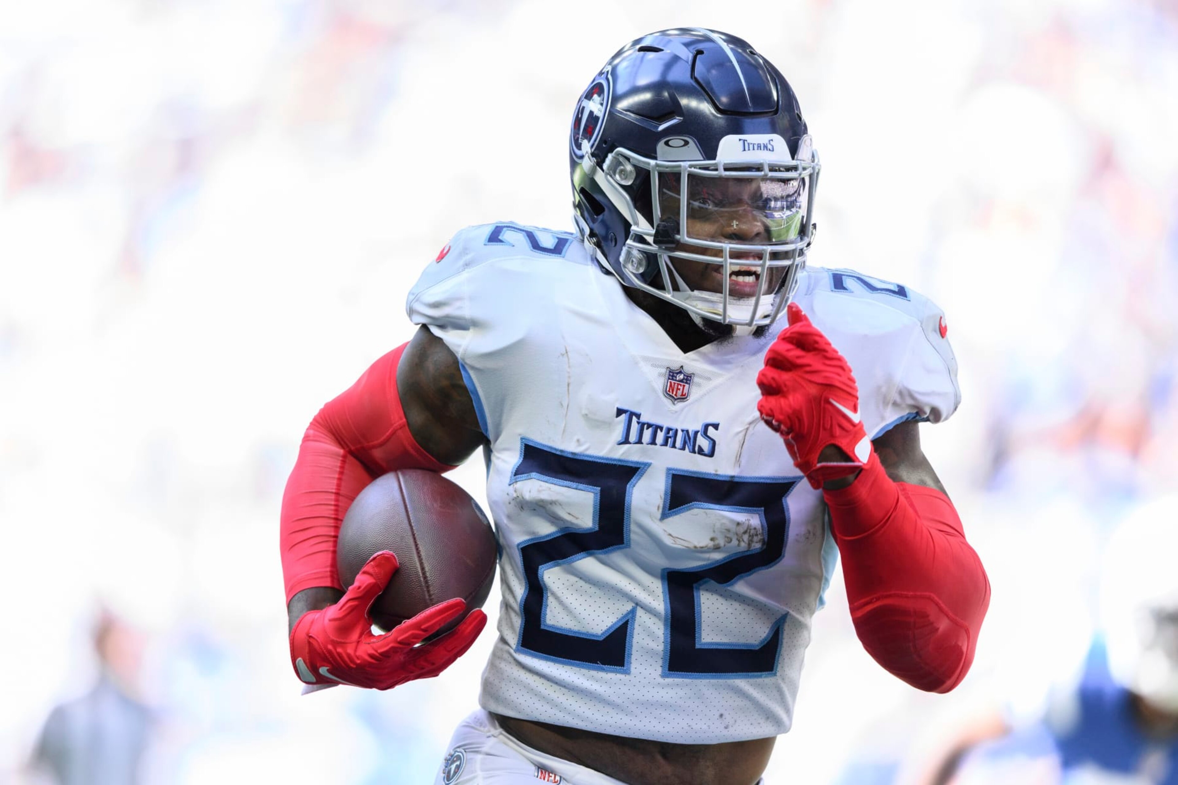 Tennessee Titans running back Derrick Henry (22) takes a handoff to the outside during an NFL football game against the Indianapolis Colts, Sunday, Oct. 2, 2022, in Indianapolis. (AP Photo/Zach Bolinger)