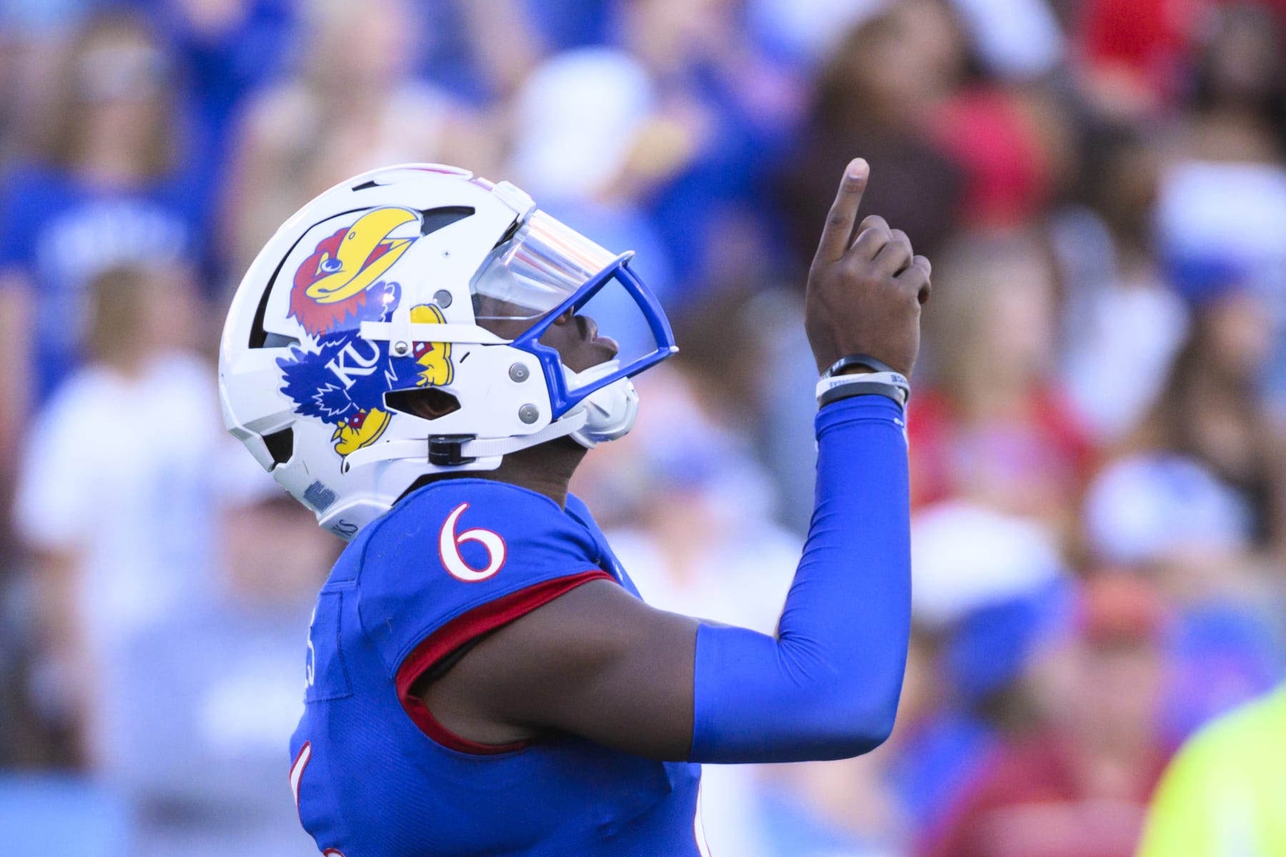 Kansas quarterback Jalon Daniels points skyward before starting a series against Iowa State during the second half of an NCAA college football game Saturday, Oct. 1, 2022, in Lawrence, Kan. (AP Photo/Reed Hoffmann)