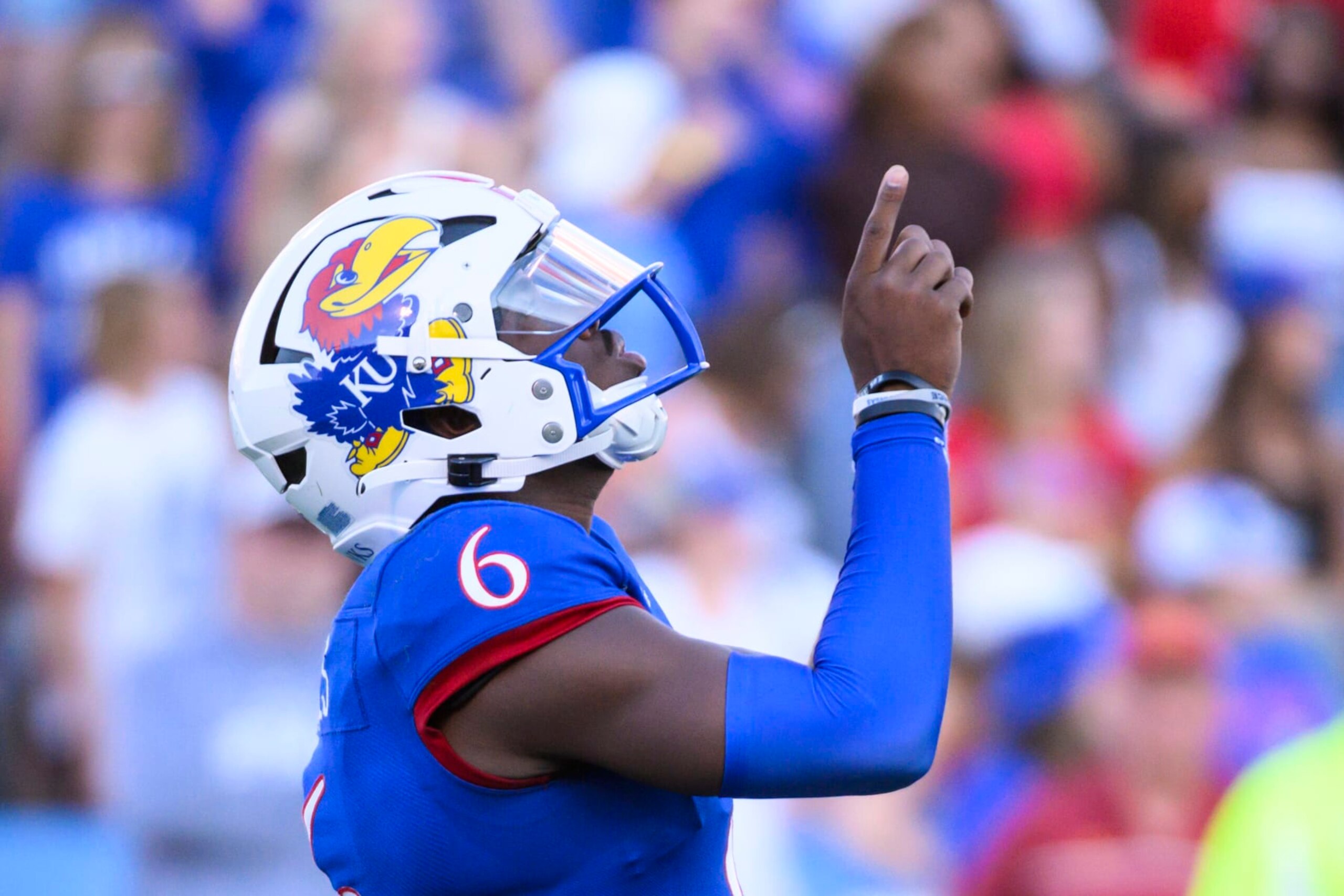 Kansas quarterback Jalon Daniels points skyward before starting a series against Iowa State during the second half of an NCAA college football game Saturday, Oct. 1, 2022, in Lawrence, Kan. (AP Photo/Reed Hoffmann)