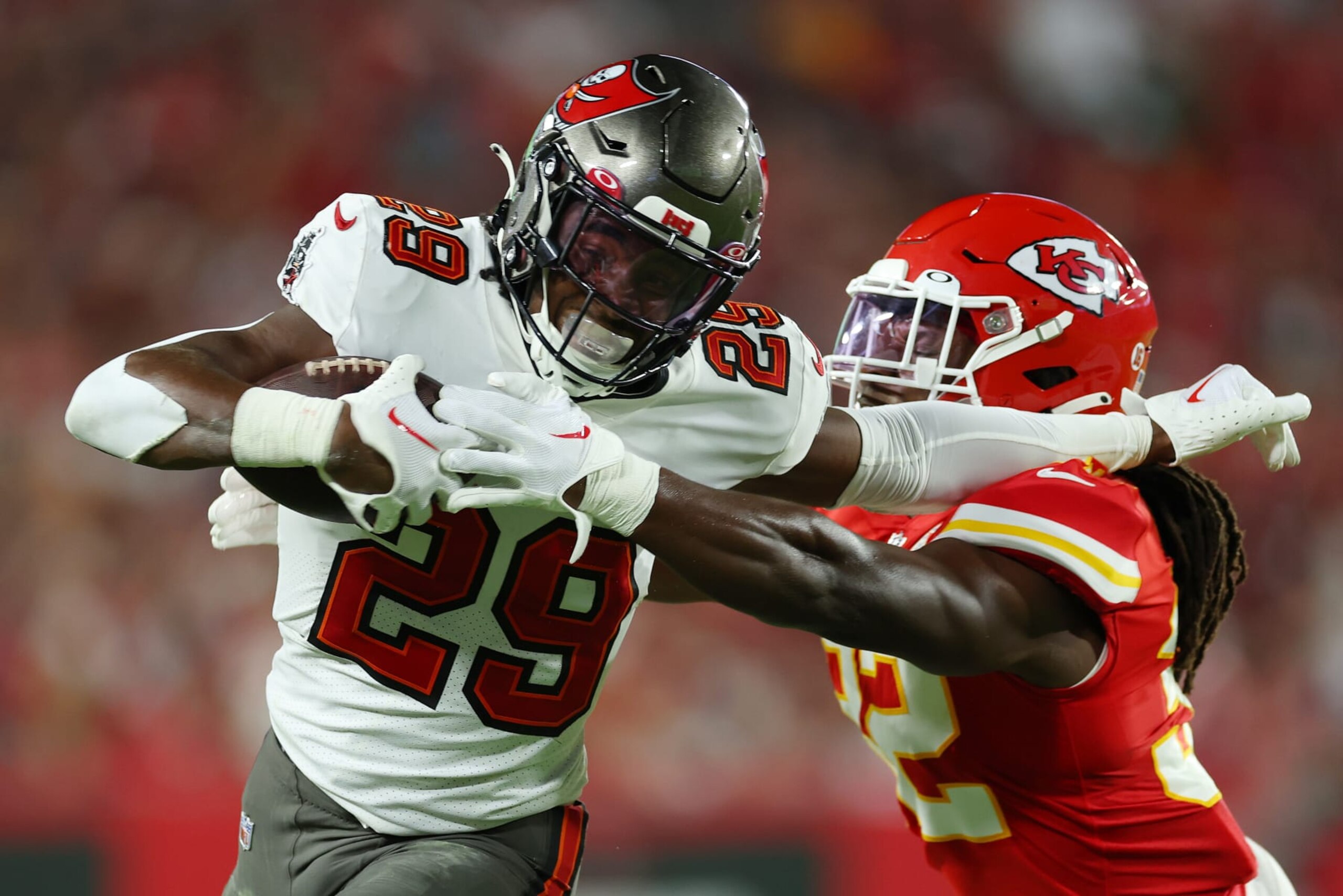 TAMPA, FLORIDA - OCTOBER 02: Rachaad White #29 of the Tampa Bay Buccaneers stiff arms Nick Bolton #32 of the Kansas City Chiefs during the second quarterat Raymond James Stadium on October 02, 2022 in Tampa, Florida. (Photo by Mike Ehrmann/Getty Images)