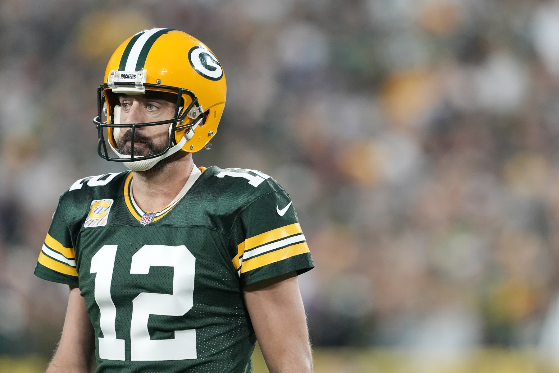 GREEN BAY, WISCONSIN - OCTOBER 02: Aaron Rodgers #12 of the Green Bay Packers reacts after a play in overtime against the New England Patriots at Lambeau Field on October 02, 2022 in Green Bay, Wisconsin. (Photo by Patrick McDermott/Getty Images)
