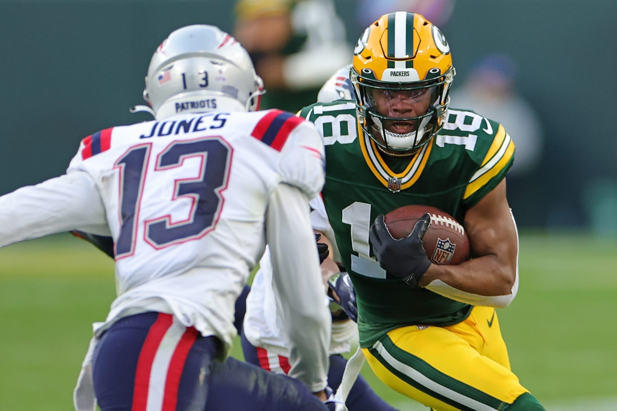 GREEN BAY, WISCONSIN - OCTOBER 02: Randall Cobb #18 of the Green Bay Packers is pursued by Jack Jones #13 of the New England Patriots at Lambeau Field on October 02, 2022 in Green Bay, Wisconsin. The Packers defeated the Patriots 27-24 in overtime. (Photo by Stacy Revere/Getty Images) GREEN BAY, WISCONSIN - OCTOBER 02: Randall Cobb #18 of the Green Bay Packers is pursued by Jack Jones #13 of the New England Patriots at Lambeau Field on October 02, 2022 in Green Bay, Wisconsin. The Packers defeated the Patriots 27-24 in overtime. (Photo by Stacy Revere/Getty Images)
