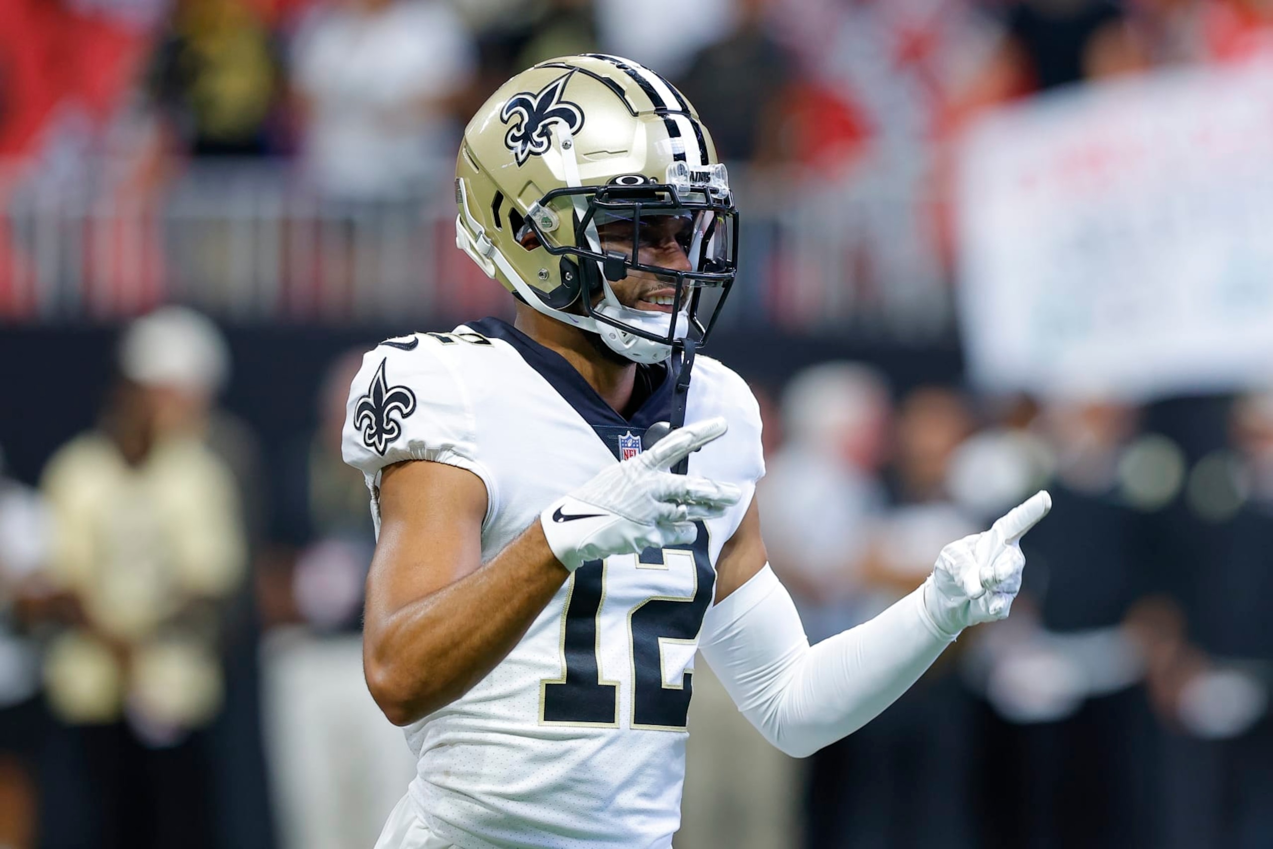 ATLANTA, GA - SEPTEMBER 11: Chris Olave #12 of the New Orleans Saints warms up prior to the game against the Atlanta Falcons at Mercedes-Benz Stadium on September 11, 2022 in Atlanta, Georgia. (Photo by Todd Kirkland/Getty Images)