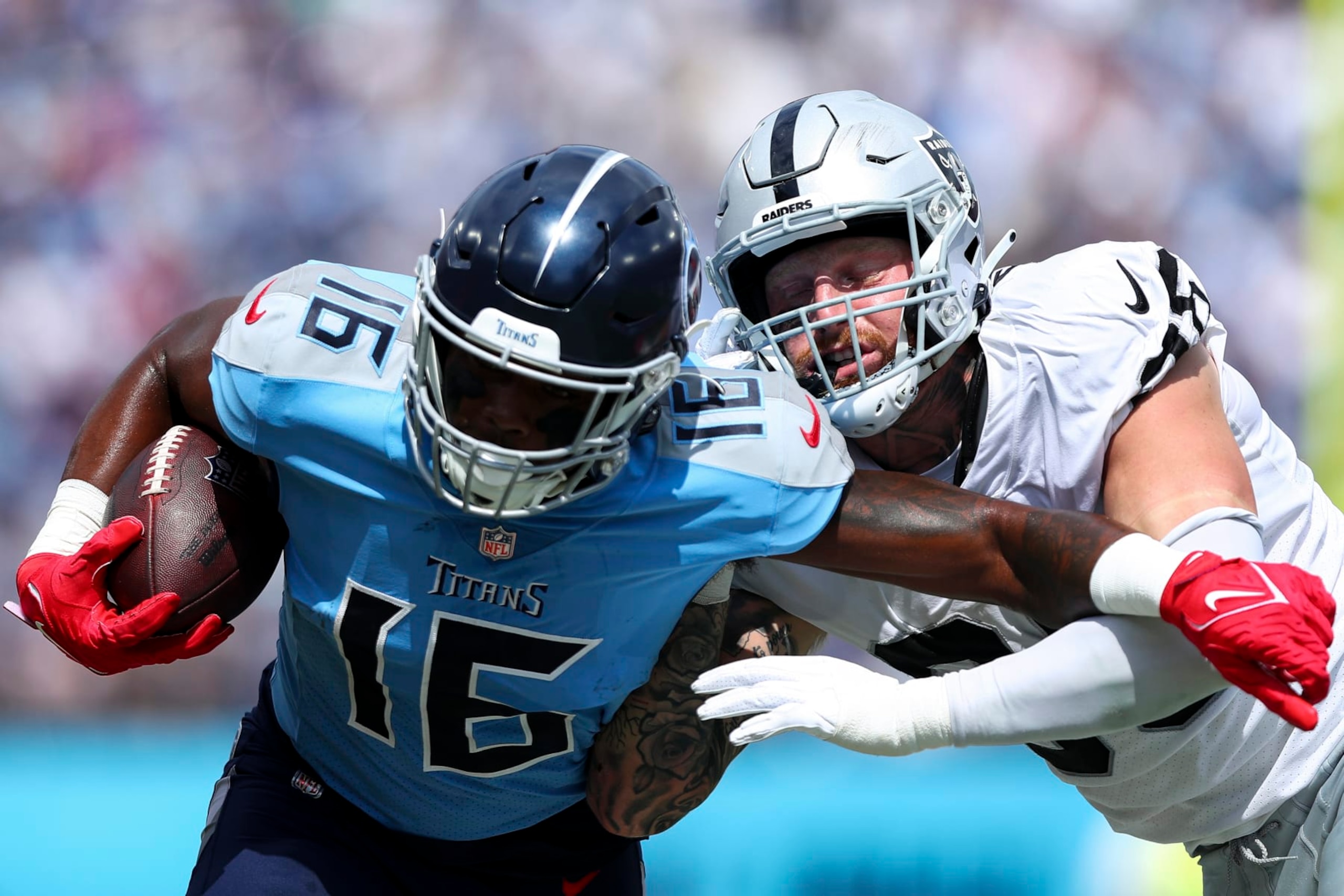 NASHVILLE, TN - SEPTEMBER 25: Maxx Crosby #98 of the Las Vegas Raiders tackles Treylon Burks #16 of the Tennessee Titans during an NFL football game at Nissan Stadium on September 25, 2022 in Nashville, Tennessee. (Photo by Kevin Sabitus/Getty Images)