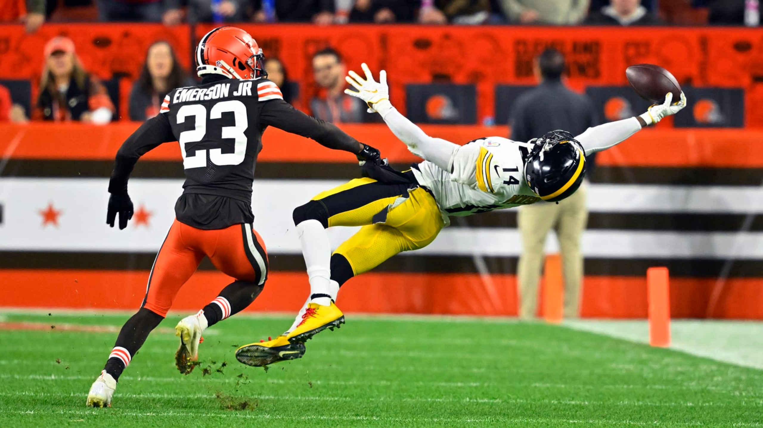 Pittsburgh Steelers wide receiver George Pickens (14) makes a one-handed catch with Cleveland Browns cornerback Martin Emerson Jr. (23) defending during the first half of an NFL football game in Cleveland, Thursday, Sept. 22, 2022. (AP Photo/David Richard)