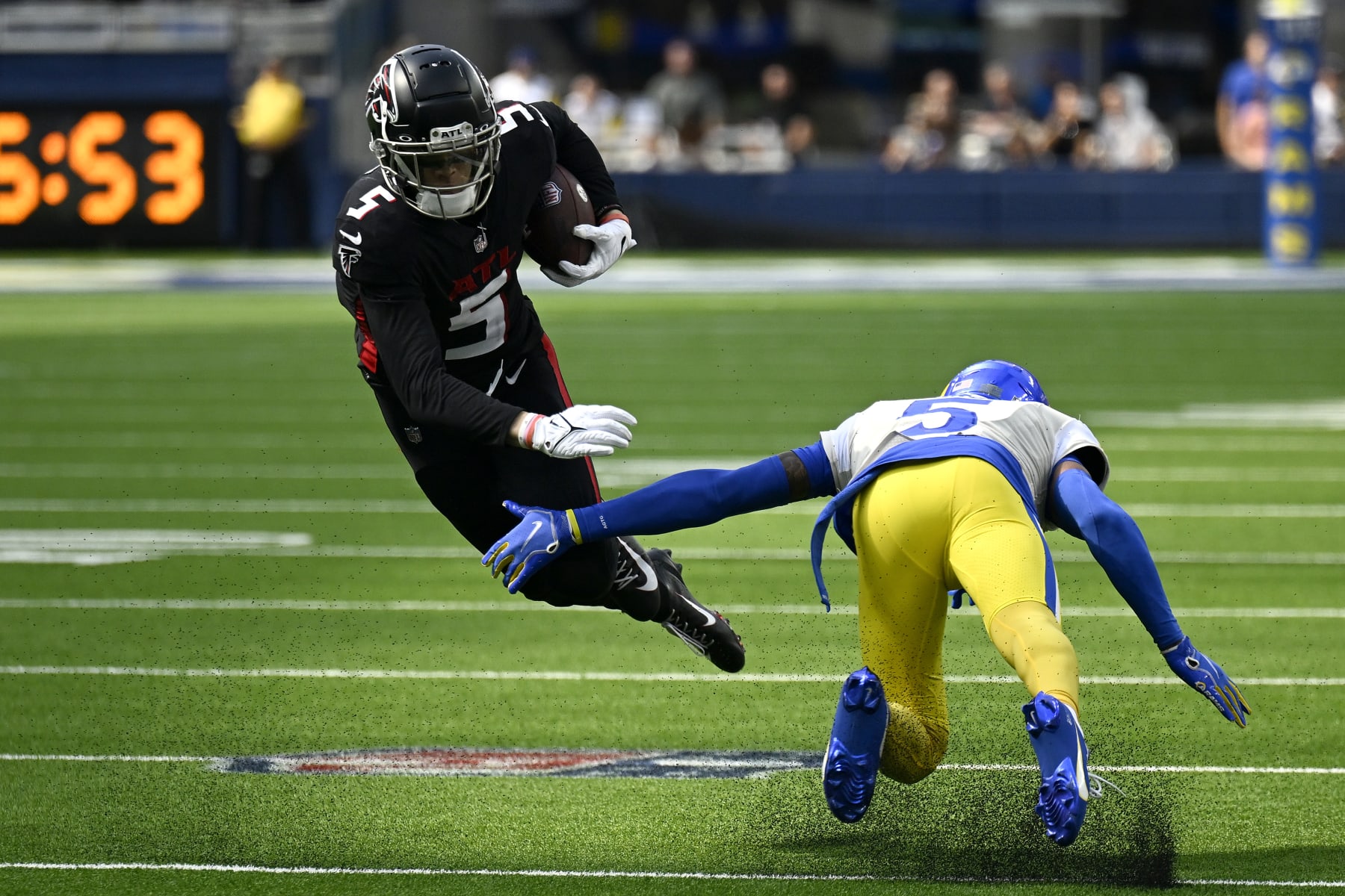INGLEWOOD, CALIFORNIA - SEPTEMBER 18: Jalen Ramsey #5 of the Los Angeles Rams tackles Drake London #5 of the Atlanta Falcons during the third quarter at SoFi Stadium on September 18, 2022 in Inglewood, California. (Photo by John McCoy/Getty Images)
