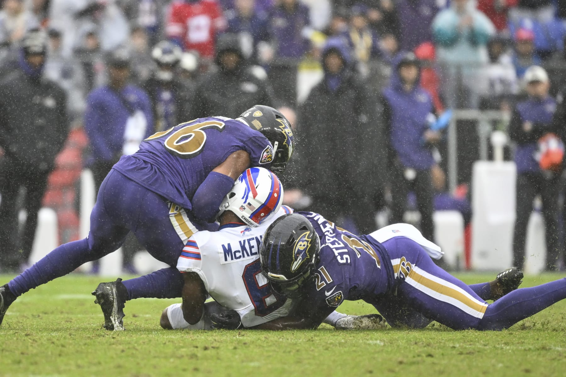 Buffalo Bills wide receiver Isaiah McKenzie (6) is hit after making a catch by Baltimore Ravens safety Chuck Clark and cornerback Brandon Stephens (21) and would leave the game with an apparent head injury during the second half of a NFL football game, Sunday, Oct. 2, 2022, in Baltimore. (AP Photo/Terrance Williams)