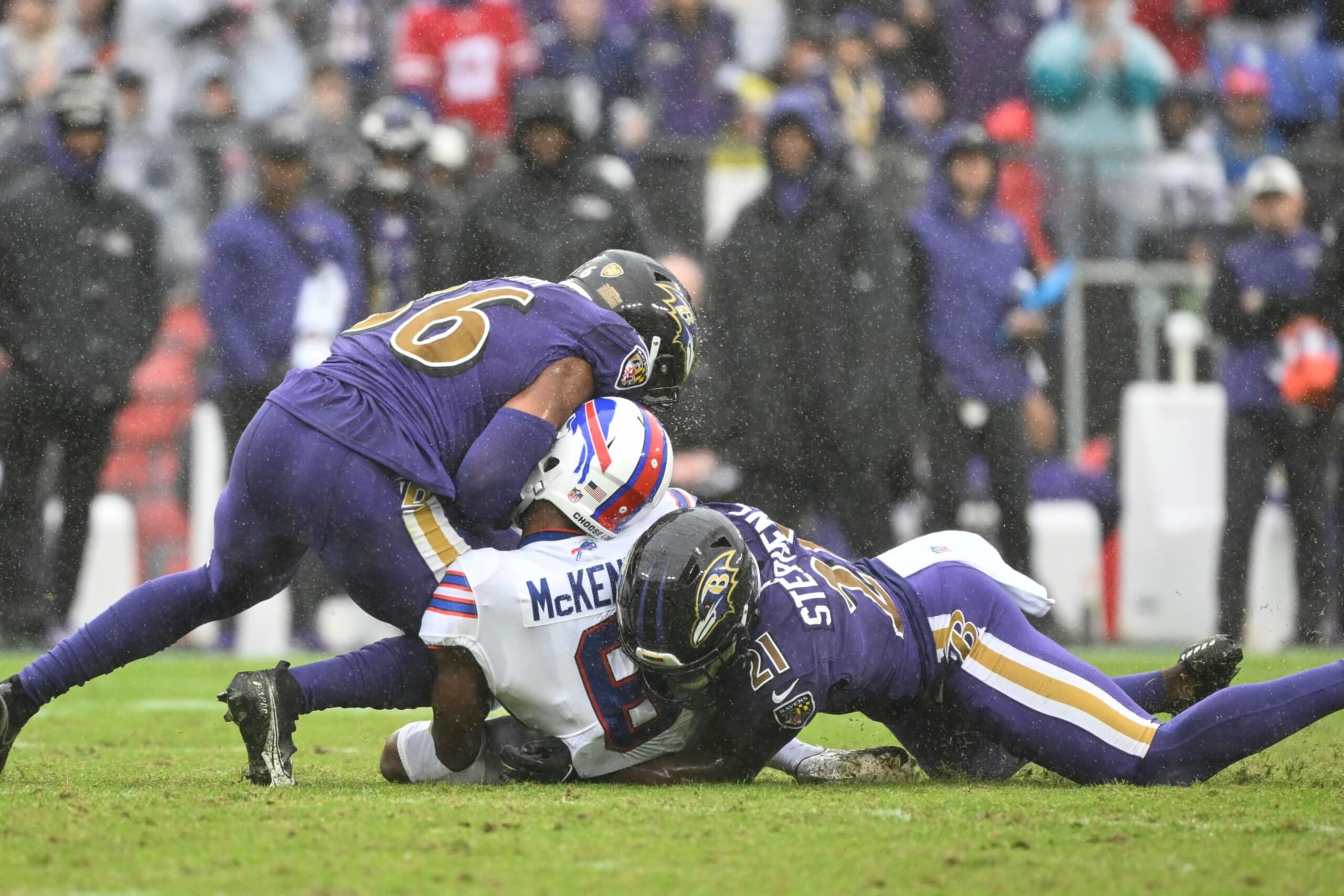 Buffalo Bills wide receiver Isaiah McKenzie (6) is hit after making a catch by Baltimore Ravens safety Chuck Clark and cornerback Brandon Stephens (21) and would leave the game with an apparent head injury during the second half of a NFL football game, Sunday, Oct. 2, 2022, in Baltimore. (AP Photo/Terrance Williams)