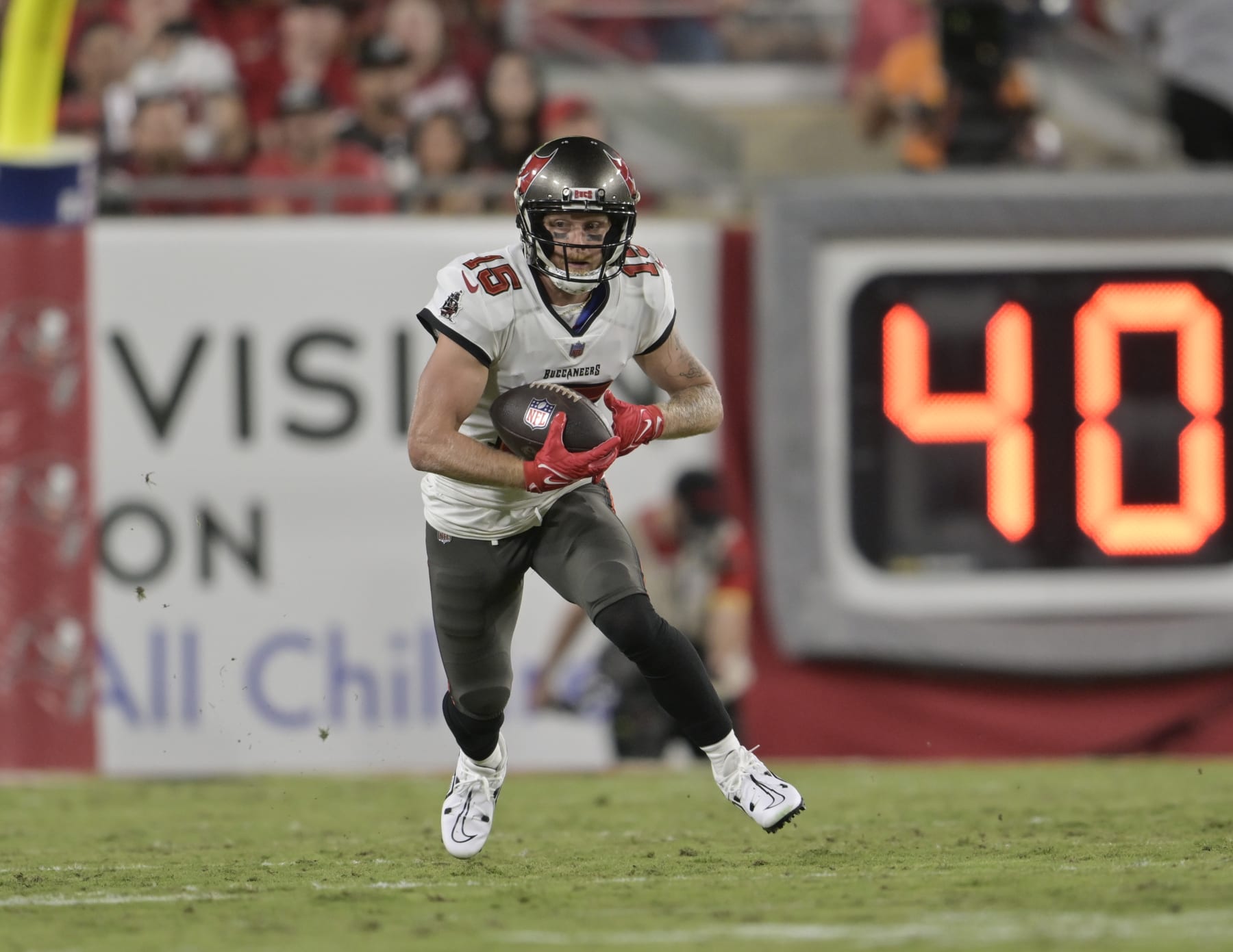 TAMPA, FL - OCTOBER 02: Tampa Bay Buccaneers Wide Receiver Cole Beasley (15) returns a punt during a game between the Kansas City Chiefs and the Tampa Bay Buccaneers on October 02, 2022, at Raymond James Stadium in Tampa, FL. (Photo by Roy K. Miller/Icon Sportswire via Getty Images)