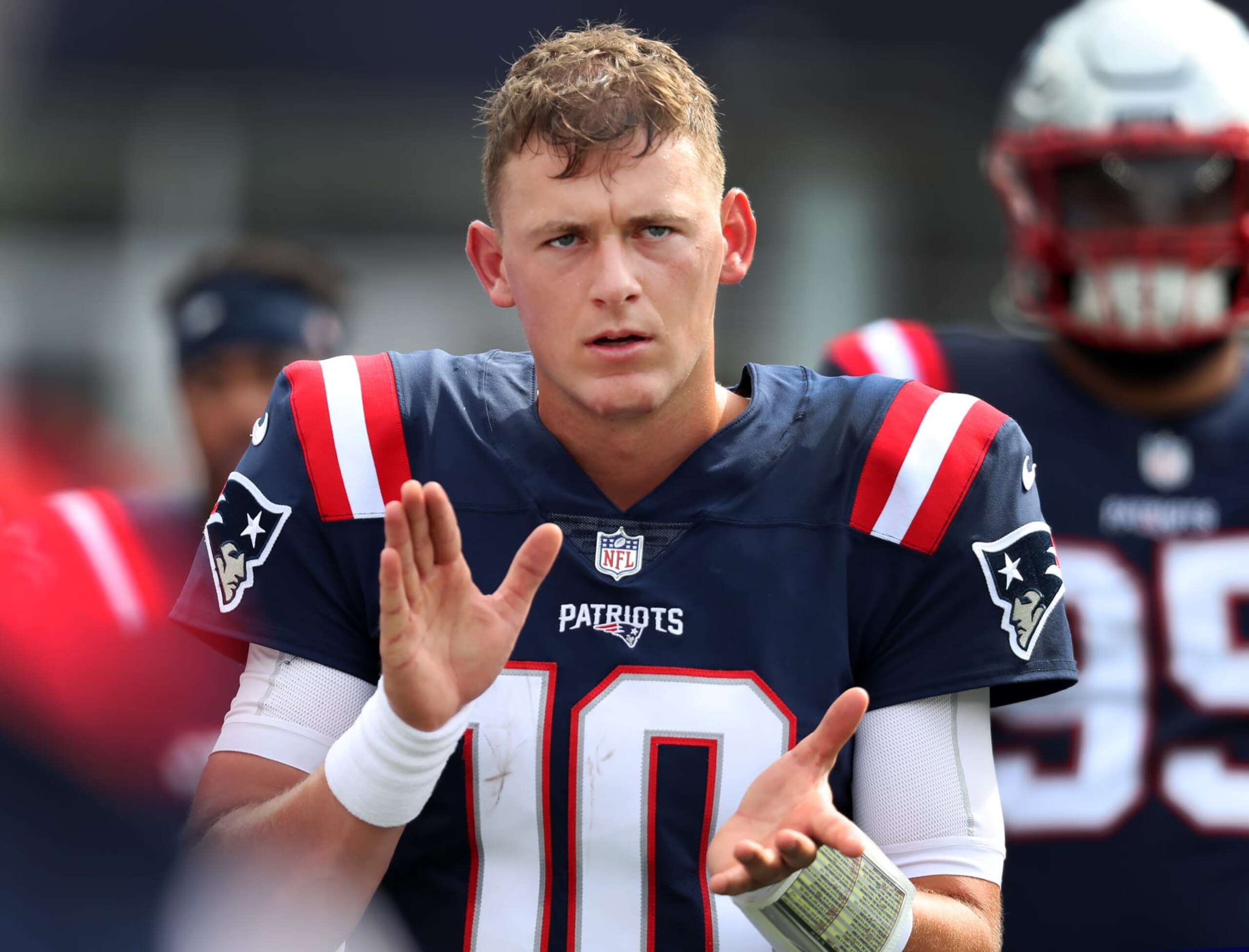 Foxborough, MA - September 25: New England Patriots quarterback Mac Jones is pictured clapping on the sidelines. The Patriots lost to the Baltimore Ravens, 37-26. (Photo by Jim Davis/The Boston Globe via Getty Images)
