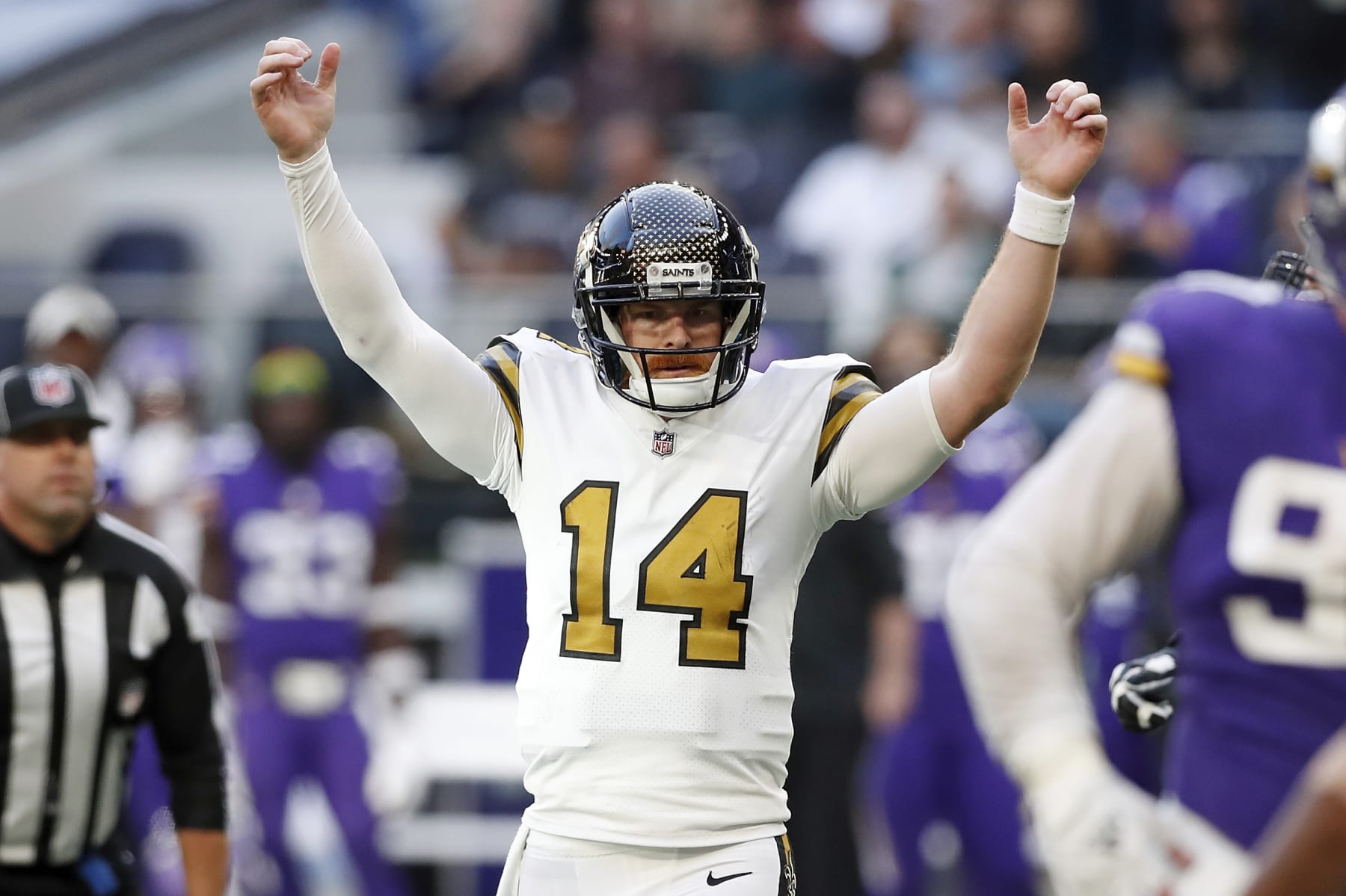 New Orleans Saints quarterback Andy Dalton (14) celebrates after scoring on a two-point conversion during an NFL football game against the Minnesota Vikings at Tottenham Hotspur Stadium, Sunday, Oct. 2, 2022, in London. (AP Photo/Steve Luciano)