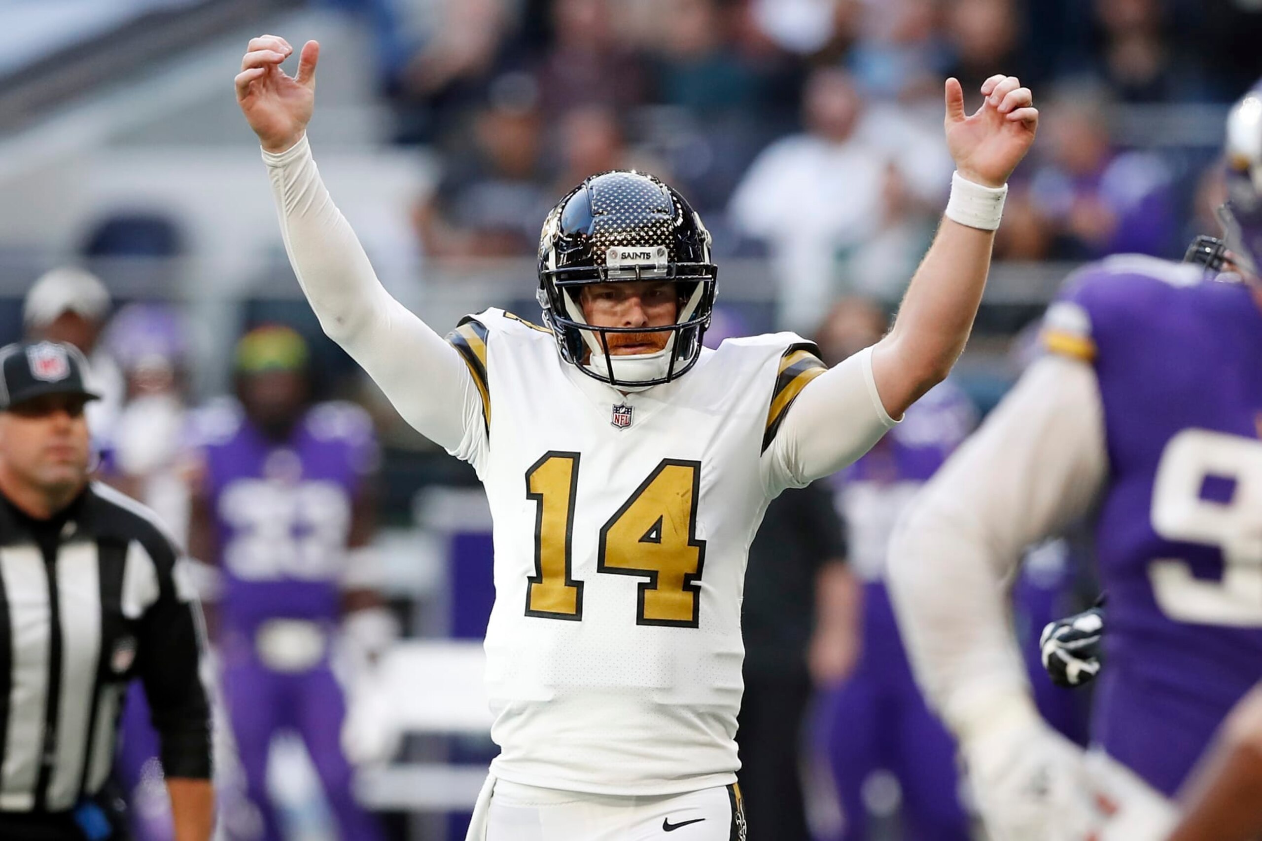 New Orleans Saints quarterback Andy Dalton (14) celebrates after scoring on a two-point conversion during an NFL football game against the Minnesota Vikings at Tottenham Hotspur Stadium, Sunday, Oct. 2, 2022, in London. (AP Photo/Steve Luciano)