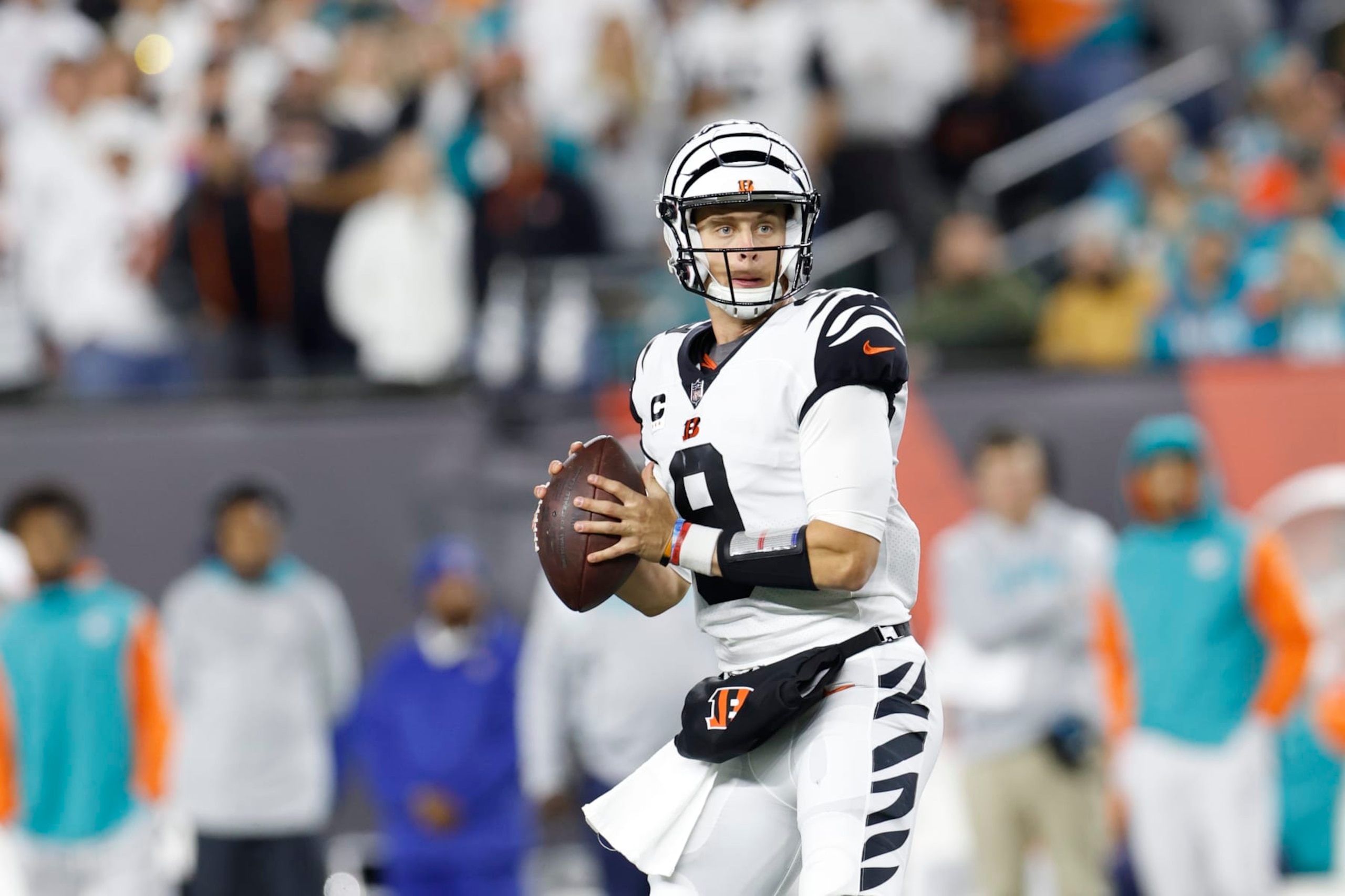 Cincinnati Bengals quarterback Joe Burrow (9) looks to pass during an NFL football game against the Miami Dolphins on Thursday, September 29, 2022, in Cincinnati. (AP Photo/Matt Patterson)