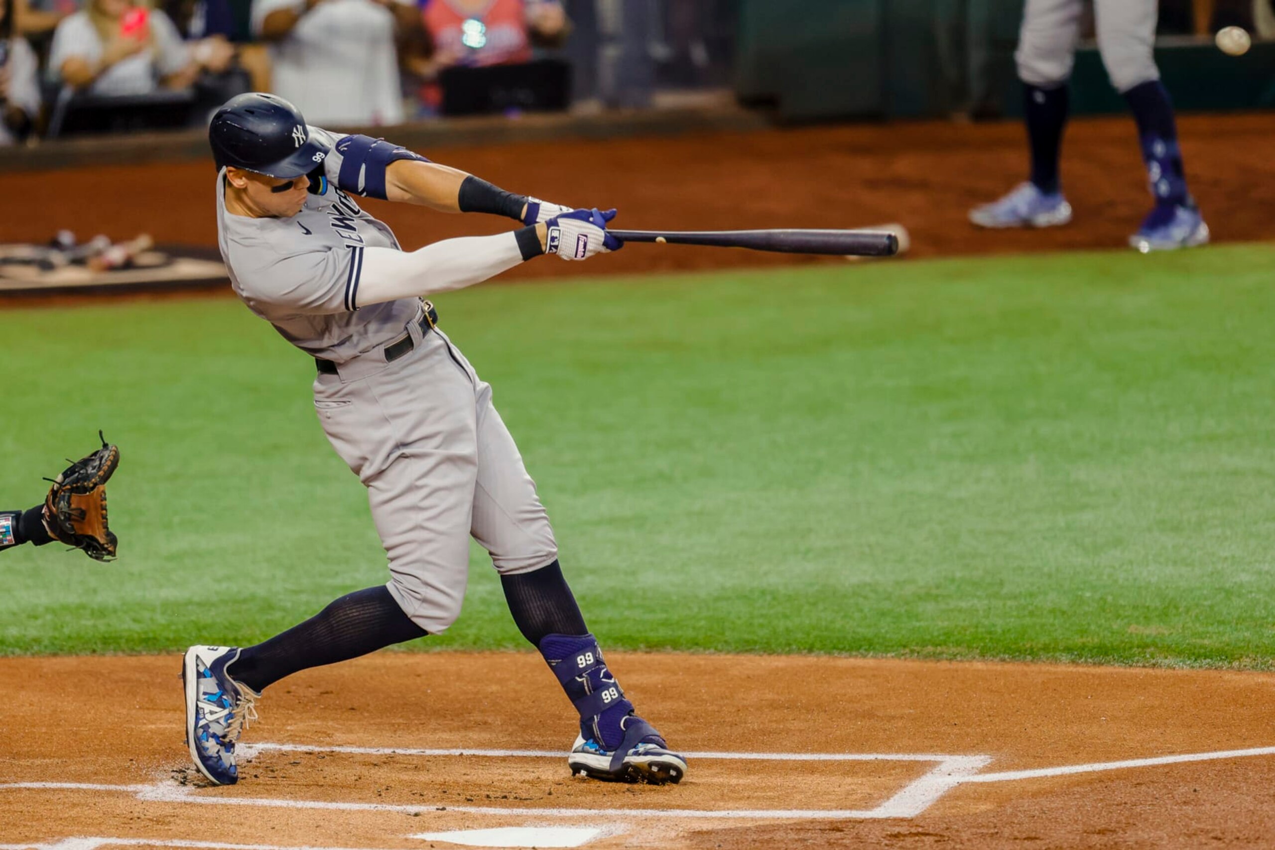 ARLINGTON, TX - OCTOBER 04: New York Yankees center fielder Aaron Judge (99) hits his 62nd home run to beat the Roger Maris home run record during the game between the Texas Rangers and the New York Yankees on October 4, 2022 at Globe Life Field in Arlington, Texas. (Photo by Matthew Pearce/Icon Sportswire via Getty Images) ARLINGTON, TX - OCTOBER 04: New York Yankees center fielder Aaron Judge (99) hits his 62nd home run to beat the Roger Maris home run record during the game between the Texas Rangers and the New York Yankees on October 4, 2022 at Globe Life Field in Arlington, Texas. (Photo by Matthew Pearce/Icon Sportswire via Getty Images)