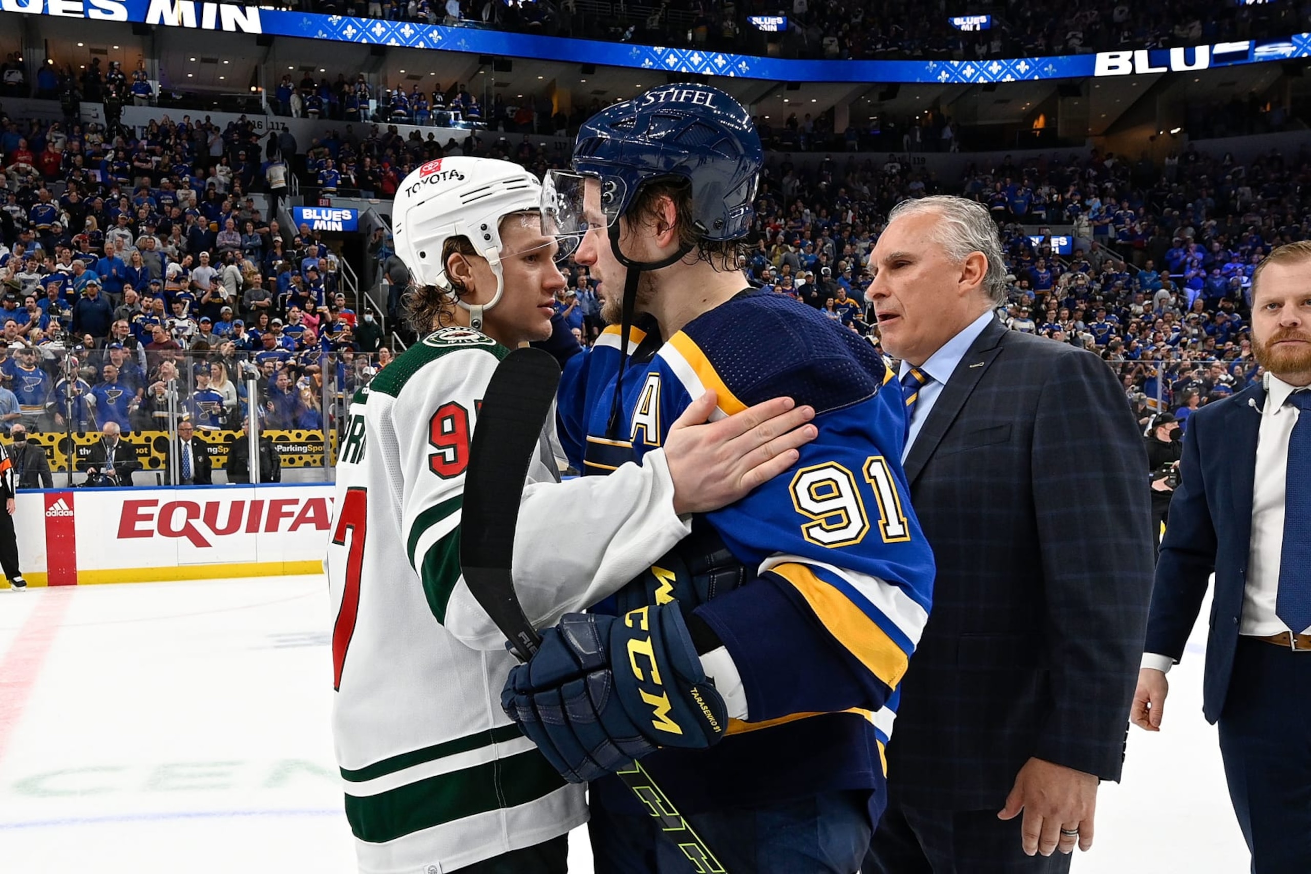 ST. LOUIS, MO - MAY 12: Kirill Kaprizov #97 of the Minnesota Wild congratulates Vladimir Tarasenko #91 of the St. Louis Blues after Game Six of the First Round of the 2022 Stanley Cup Playoffs at the Enterprise Center on May 12, 2022 in St. Louis, Missouri. (Photo by Scott Rovak/NHLI via Getty Images)