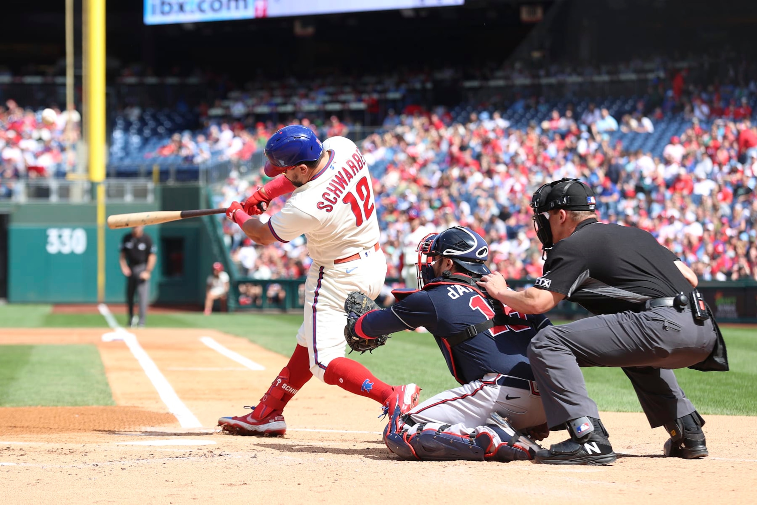 PHILADELPHIA, PENNSYLVANIA - SEPTEMBER 25: Kyle Schwarber #12 of the Philadelphia Phillies hits a solo home run during the first inning against the Atlanta Braves at Citizens Bank Park on September 25, 2022 in Philadelphia, Pennsylvania. (Photo by Tim Nwachukwu/Getty Images) PHILADELPHIA, PENNSYLVANIA - SEPTEMBER 25: Kyle Schwarber #12 of the Philadelphia Phillies hits a solo home run during the first inning against the Atlanta Braves at Citizens Bank Park on September 25, 2022 in Philadelphia, Pennsylvania. (Photo by Tim Nwachukwu/Getty Images)