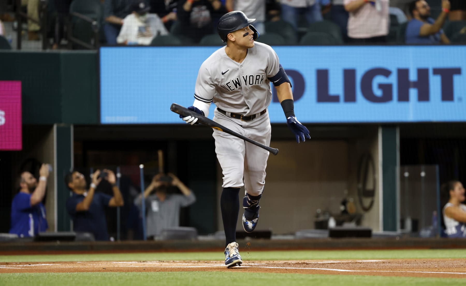 ARLINGTON, TX - OCTOBER 4: 
Aaron Judge #99 of the New York Yankees watches the ball after hitting his 62nd home run of the season against the Texas Rangers during the first inning in game two of a double header at Globe Life Field on October 4, 2022 in Arlington, Texas. Judge has now set the American League record for home runs in a single season. (Photo by Ron Jenkins/Getty Images)