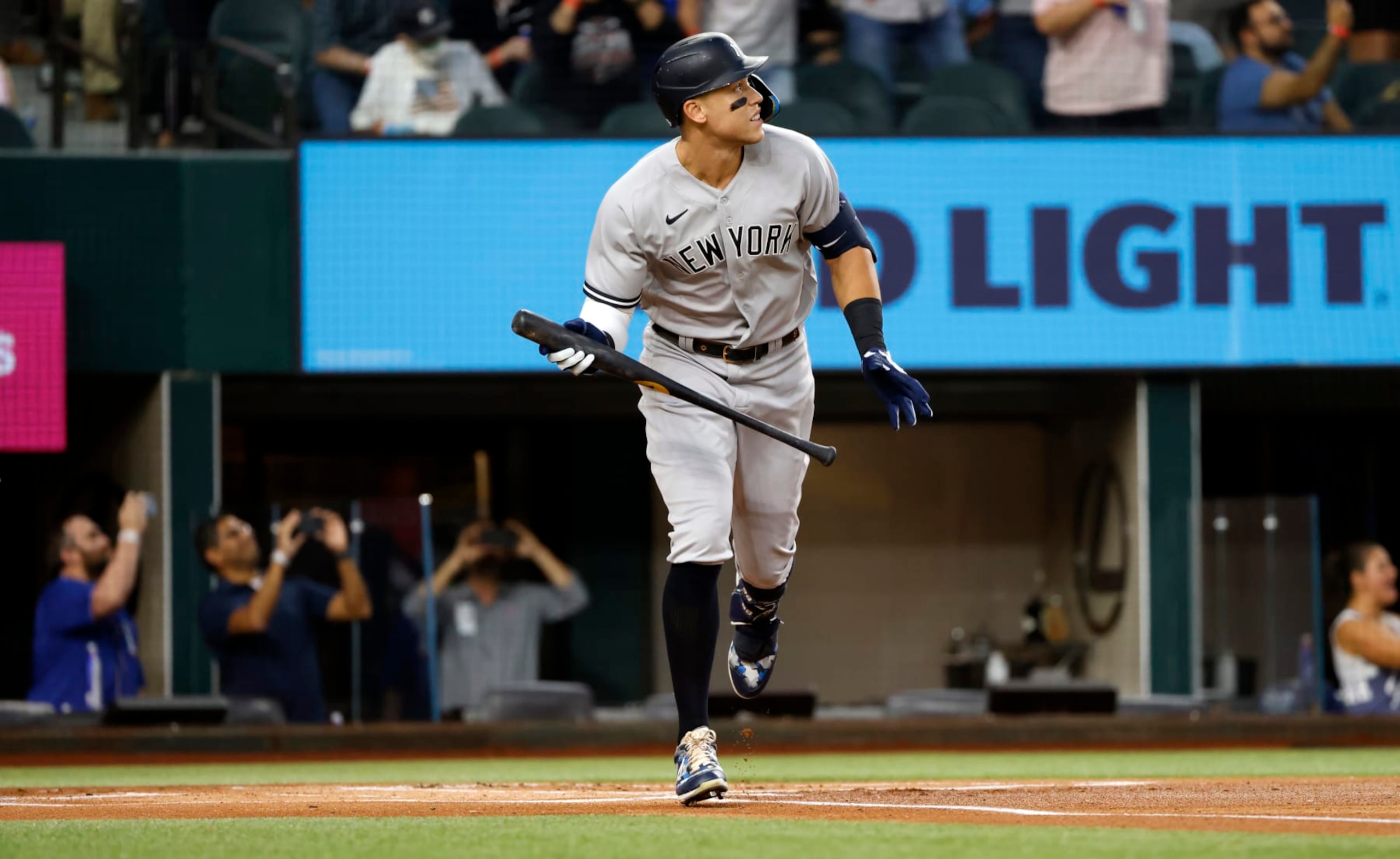 ARLINGTON, TX - OCTOBER 4:
Aaron Judge #99 of the New York Yankees watches the ball after hitting his 62nd home run of the season against the Texas Rangers during the first inning in game two of a double header at Globe Life Field on October 4, 2022 in Arlington, Texas. Judge has now set the American League record for home runs in a single season. (Photo by Ron Jenkins/Getty Images) ARLINGTON, TX - OCTOBER 4:
Aaron Judge #99 of the New York Yankees watches the ball after hitting his 62nd home run of the season against the Texas Rangers during the first inning in game two of a double header at Globe Life Field on October 4, 2022 in Arlington, Texas. Judge has now set the American League record for home runs in a single season. (Photo by Ron Jenkins/Getty Images)