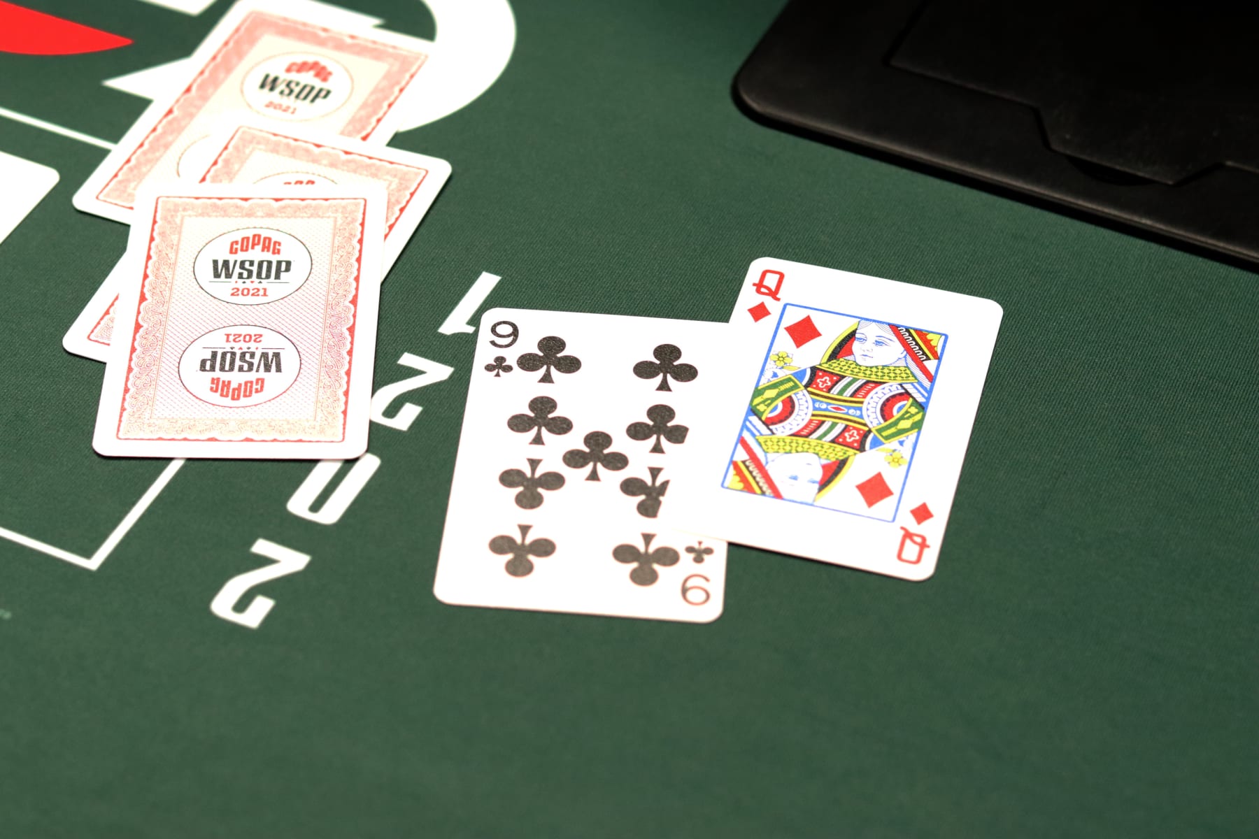 LAS VEGAS, NV - OCTOBER 6: Green poker table with poker cards are seen during the World Series of Poker 2021 at RIO All-Suite Hotel & Casino on October 6, 2021, in Las Vegas, Nevada, United States. (Photo by Diego Ribas/PxImages)