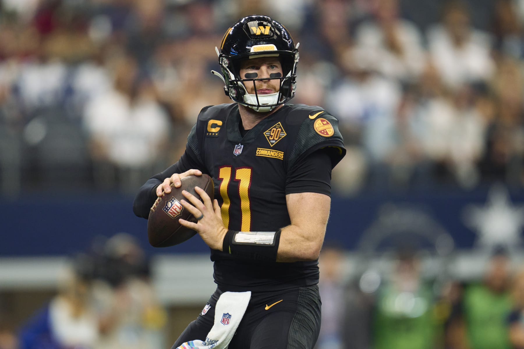 ARLINGTON, TX - OCTOBER 02: Carson Wentz #11 of the Washington Commanders drops back to pass against the Dallas Cowboys at AT&T Stadium on October 2, 2022 in Arlington, Texas. (Photo by Cooper Neill/Getty Images)