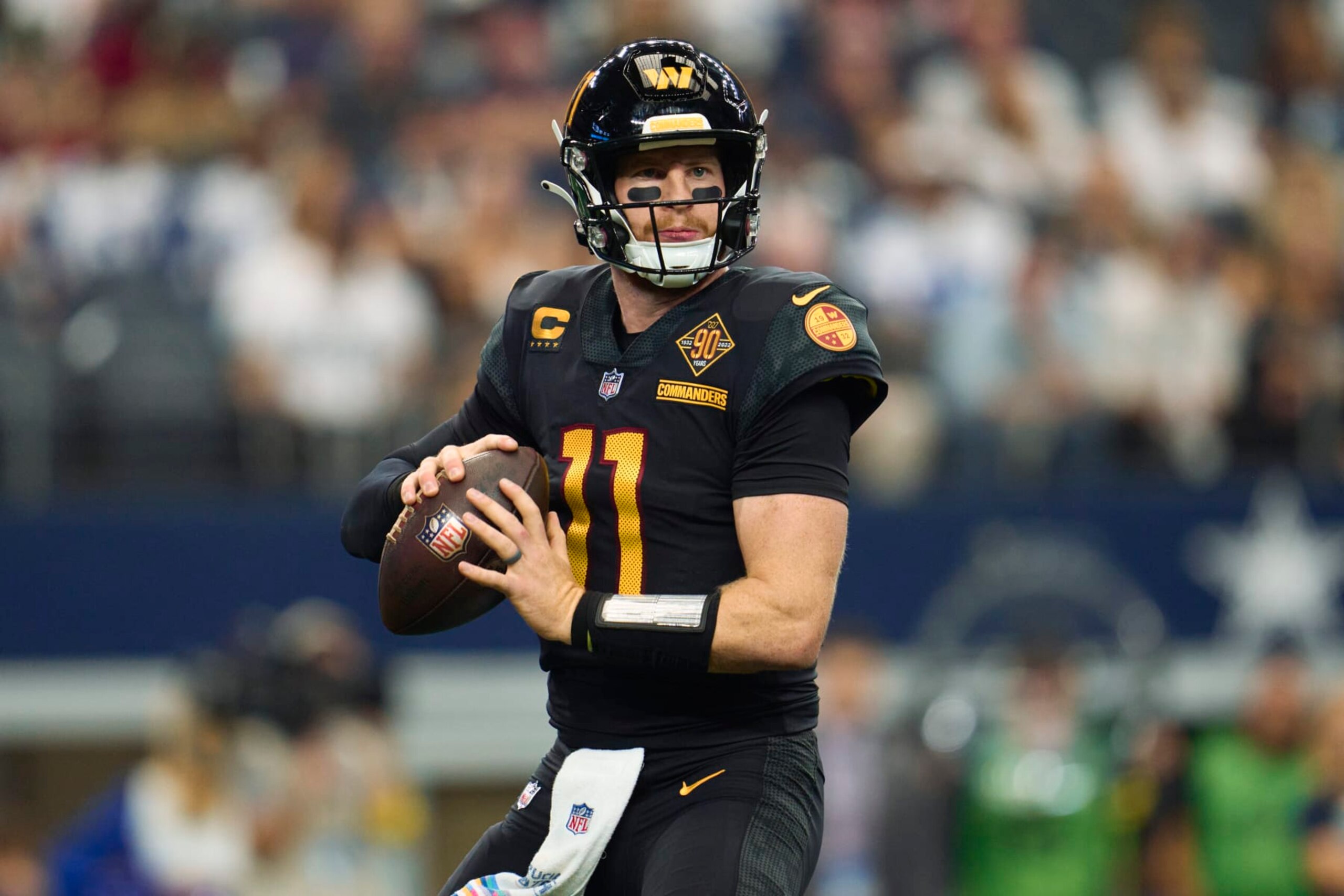 ARLINGTON, TX - OCTOBER 02: Carson Wentz #11 of the Washington Commanders drops back to pass against the Dallas Cowboys at AT&T Stadium on October 2, 2022 in Arlington, Texas. (Photo by Cooper Neill/Getty Images)