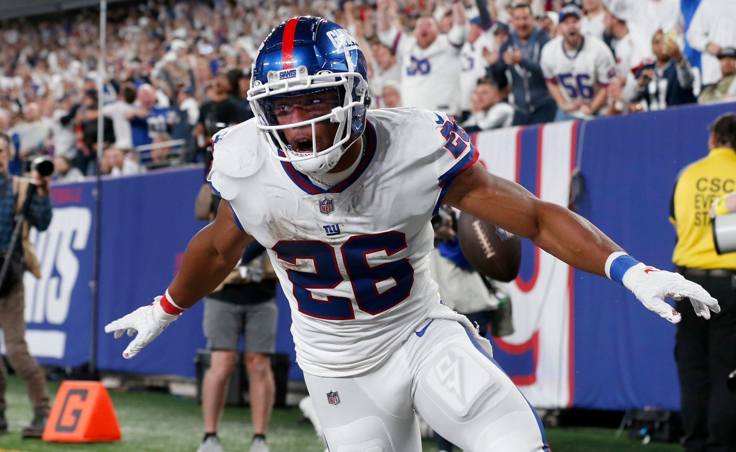 EAST RUTHERFORD, NEW JERSEY - SEPTEMBER 26: (NEW YORK DAILIES OUT)  Saquon Barkley #26 of the New York Giants celebrates his touchdown against the Dallas Cowboys at MetLife Stadium on September 26, 2022 in East Rutherford, New Jersey. The Cowboys defeated the Giants 23-16. (Photo by Jim McIsaac/Getty Images)