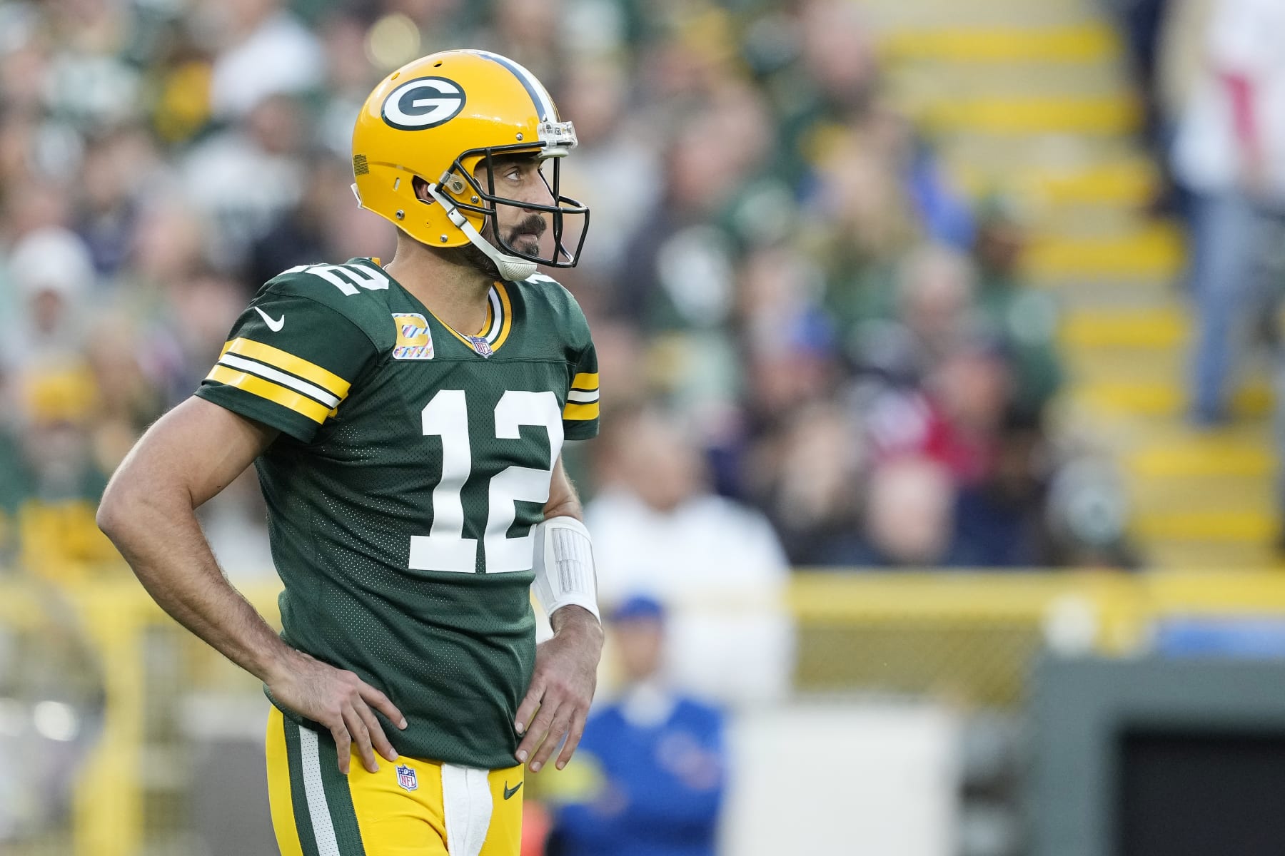 GREEN BAY, WISCONSIN - OCTOBER 02: Aaron Rodgers #12 of the Green Bay Packers reacts after a play in the second half against the New England Patriots at Lambeau Field on October 02, 2022 in Green Bay, Wisconsin. (Photo by Patrick McDermott/Getty Images)