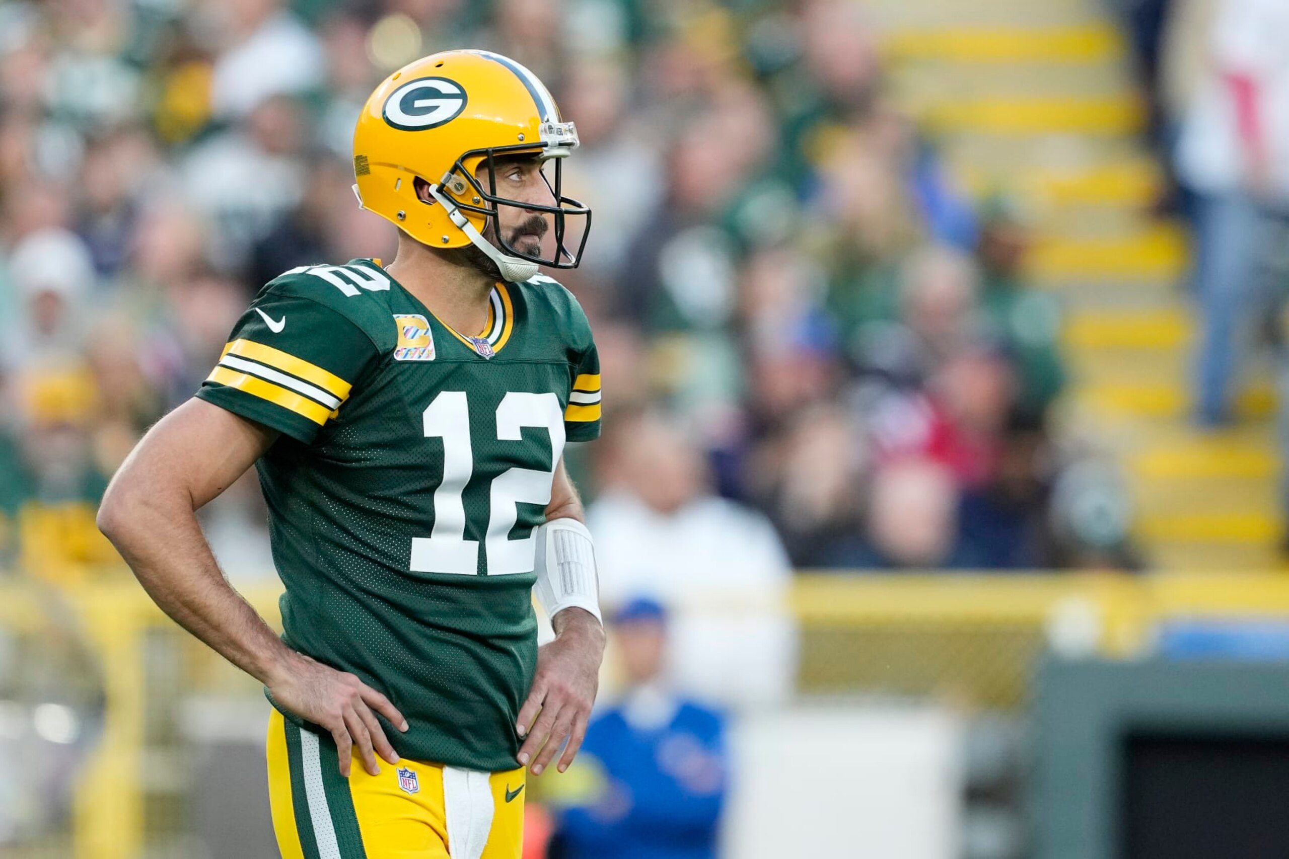 GREEN BAY, WISCONSIN - OCTOBER 02: Aaron Rodgers #12 of the Green Bay Packers reacts after a play in the second half against the New England Patriots at Lambeau Field on October 02, 2022 in Green Bay, Wisconsin. (Photo by Patrick McDermott/Getty Images)
