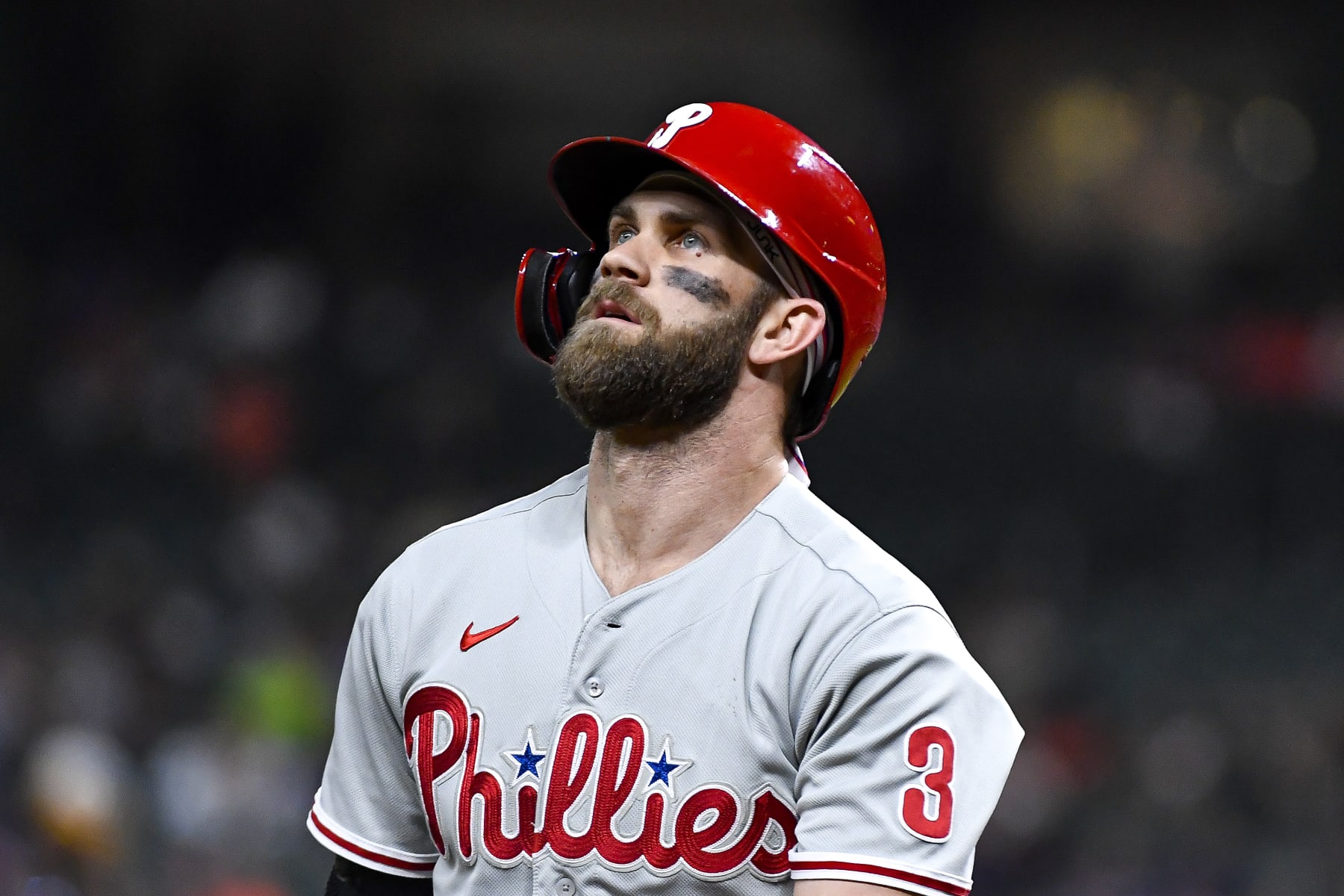 HOUSTON, TEXAS - OCTOBER 04: Bryce Harper #3 of the Philadelphia Phillies walks to the dugout after striking out in the first inning against the Houston Astros at Minute Maid Park on October 04, 2022 in Houston, Texas. (Photo by Logan Riely/Getty Images)