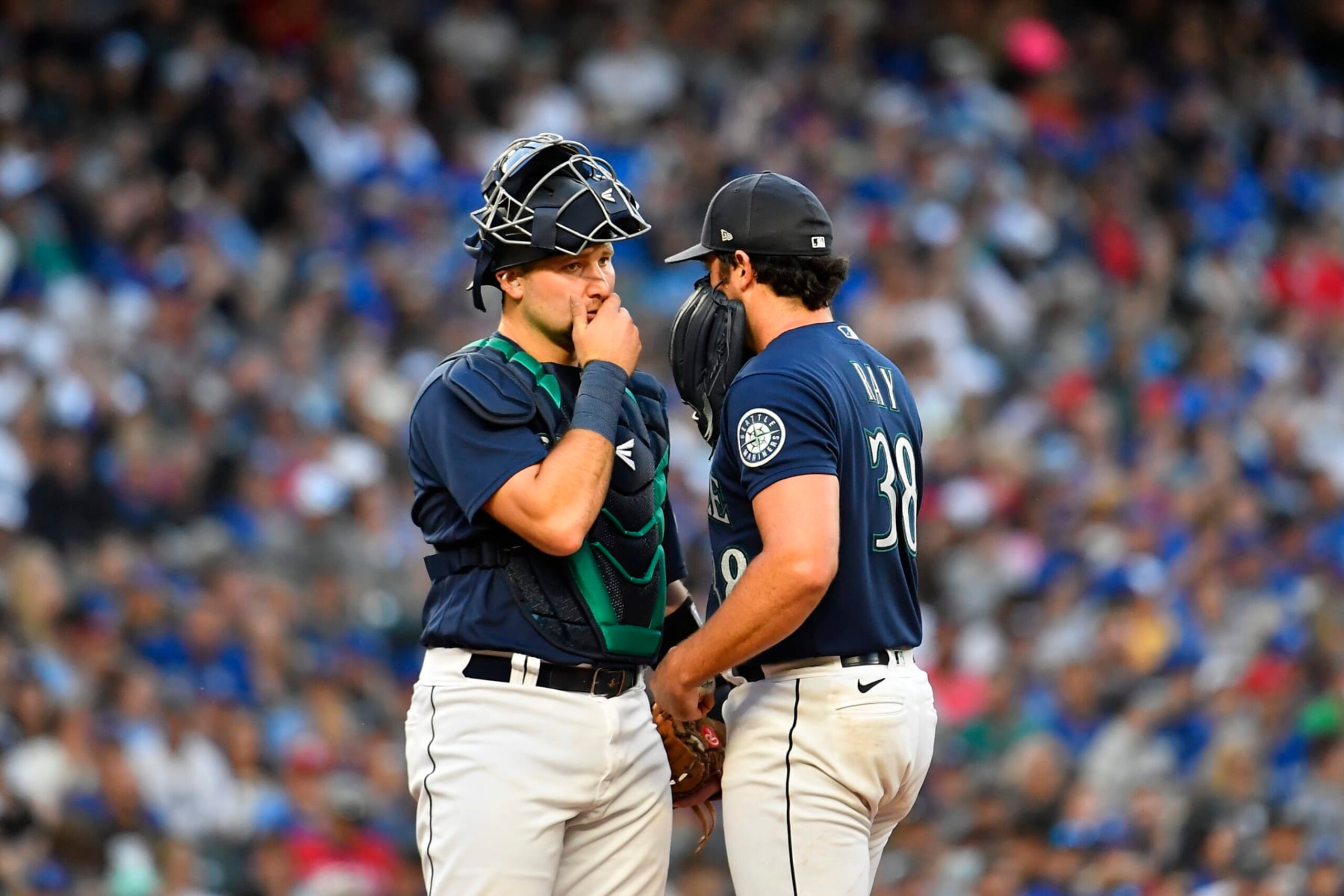 SEATTLE, WASHINGTON - JULY 09: Cal Raleigh #29 of the Seattle Mariners and Robbie Ray #38 meet at the mound during the fifth inning against the Toronto Blue Jays at T-Mobile Park on July 09, 2022 in Seattle, Washington. (Photo by Alika Jenner/Getty Images)
