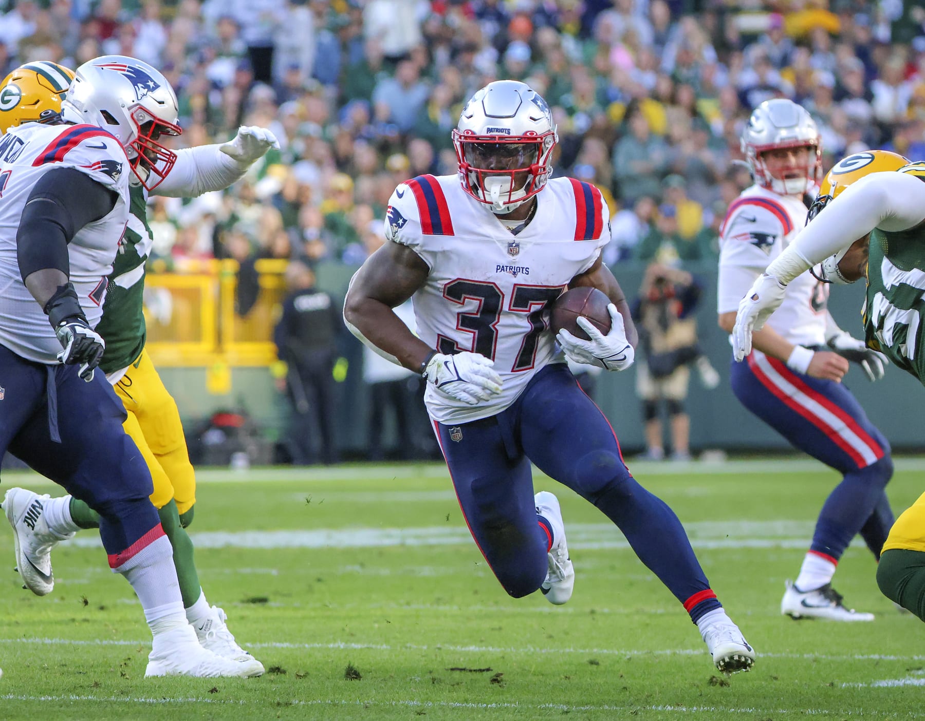 Green Bay, WI - October 2: New England Patriots RB Damien Harris runs through a big hole against the Green Bay Packers. The Patriots lost to the Packers, 27-24, in overtime. (Photo by Matthew J. Lee/The Boston Globe via Getty Images)