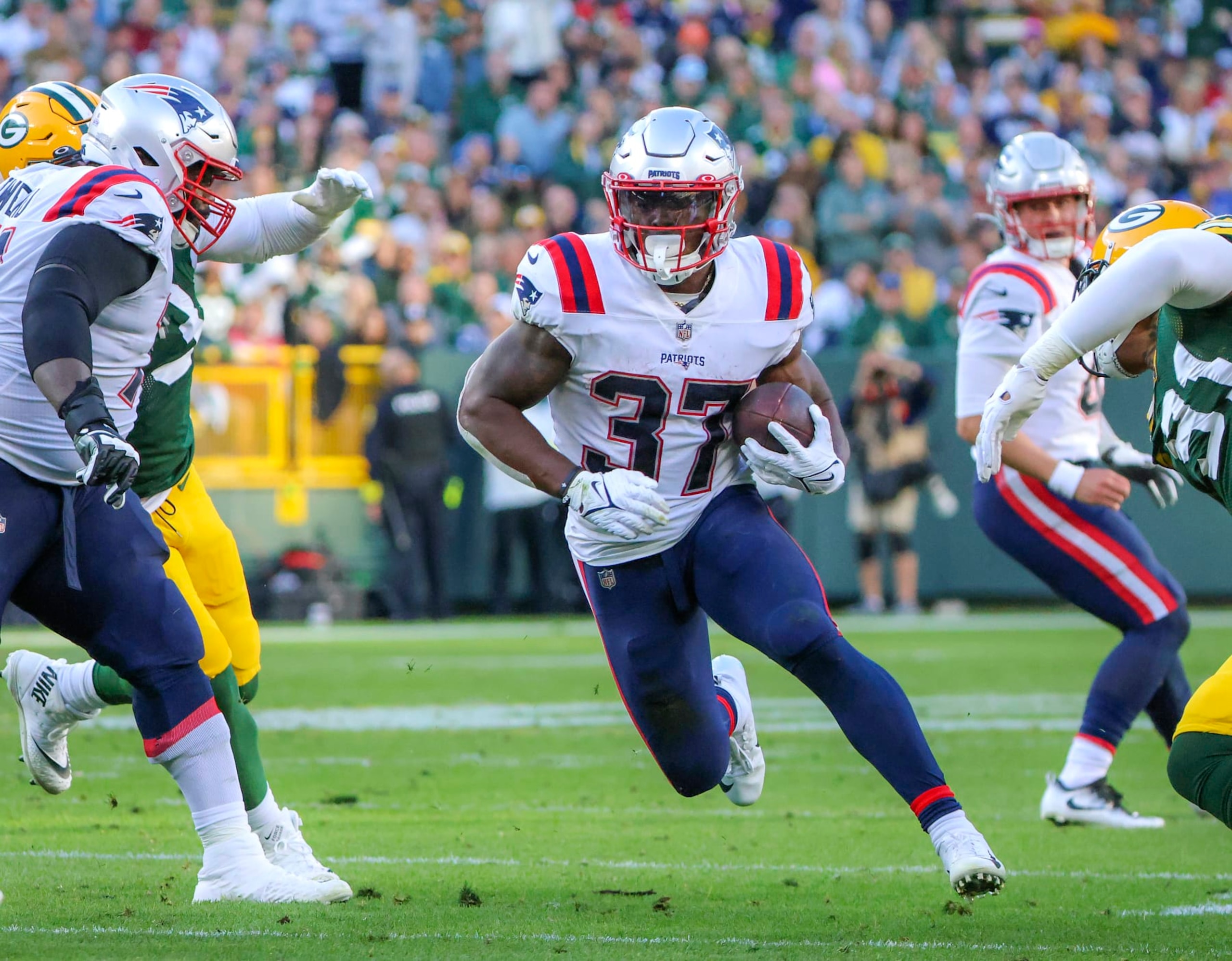 Green Bay, WI - October 2: New England Patriots RB Damien Harris runs through a big hole against the Green Bay Packers. The Patriots lost to the Packers, 27-24, in overtime. (Photo by Matthew J. Lee/The Boston Globe via Getty Images) Green Bay, WI - October 2: New England Patriots RB Damien Harris runs through a big hole against the Green Bay Packers. The Patriots lost to the Packers, 27-24, in overtime. (Photo by Matthew J. Lee/The Boston Globe via Getty Images)