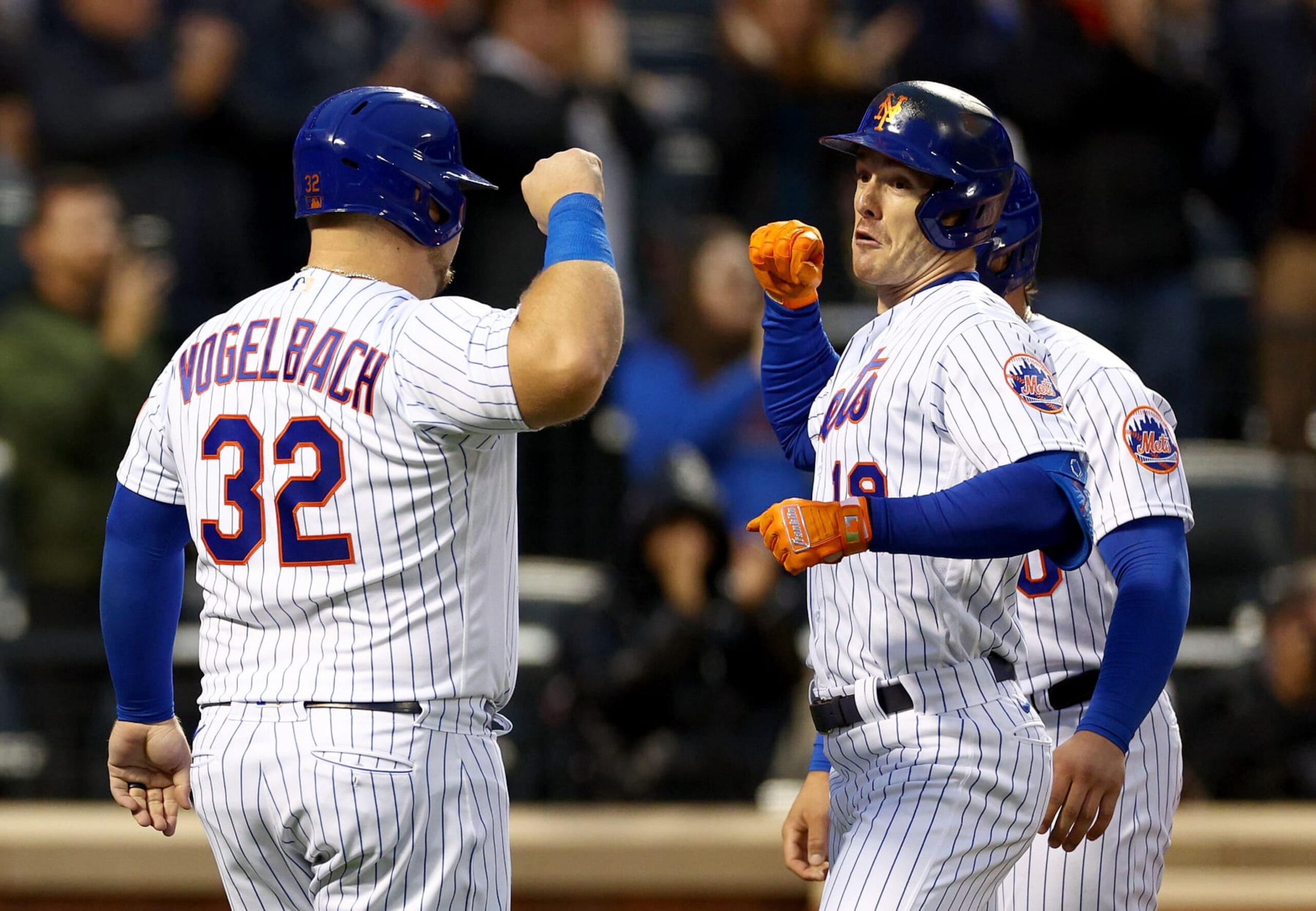 NEW YORK, NEW YORK - OCTOBER 05:  Mark Canha #19 of the New York Mets celebrates his three run home run with teammates Daniel Vogelbach #32 and Francisco Alvarez #50 in the first inning against the Washington Nationals at Citi Field on October 05, 2022 in the Flushing neighborhood of the Queens borough of New York City. (Photo by Elsa/Getty Images)