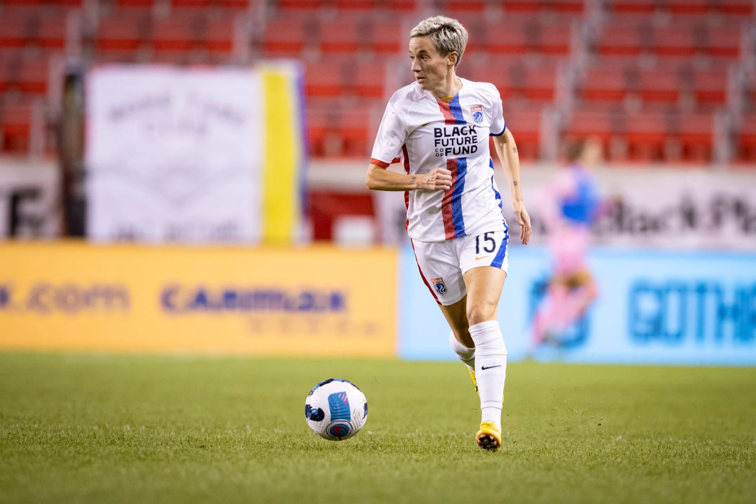 HARRISON, NJ - SEPTEMBER 21: Megan Rapinoe #15 of OL Reign takes he ball down the pitch in the second half of the National Womens Soccer League match against NJ/NY Gotham FC at Red Bull Arena on September 21, 2022 in Harrison, New Jersey. (Photo by Ira L. Black - Corbis/Getty Images)