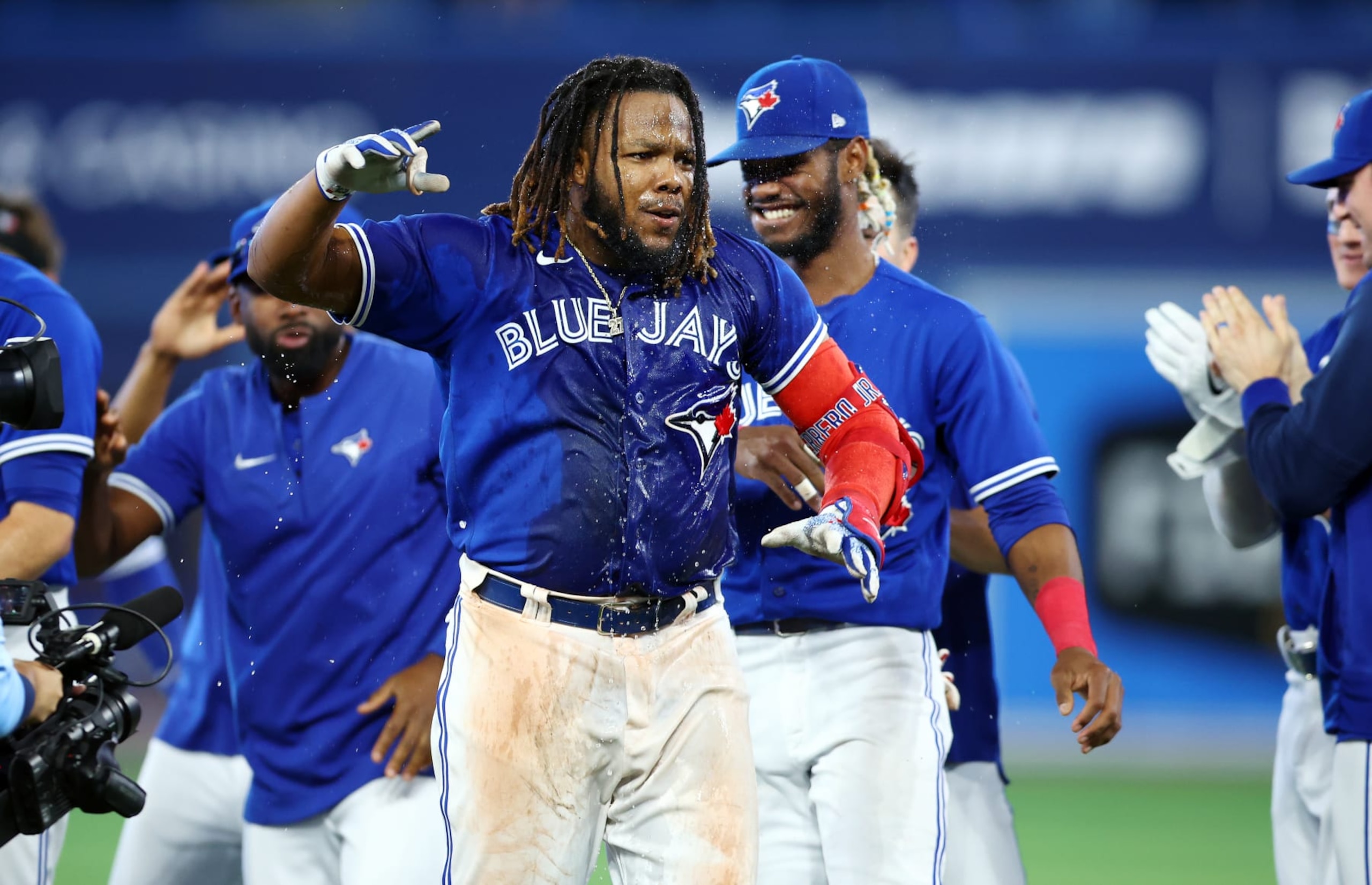 TORONTO, ON - SEPTEMBER 26:  Vladimir Guerrero Jr. #27 of the Toronto Blue Jays celebrates his walk-off RBI single in the tenth inning against the New York Yankees at Rogers Centre on September 26, 2022 in Toronto, Ontario, Canada.  (Photo by Vaughn Ridley/Getty Images)