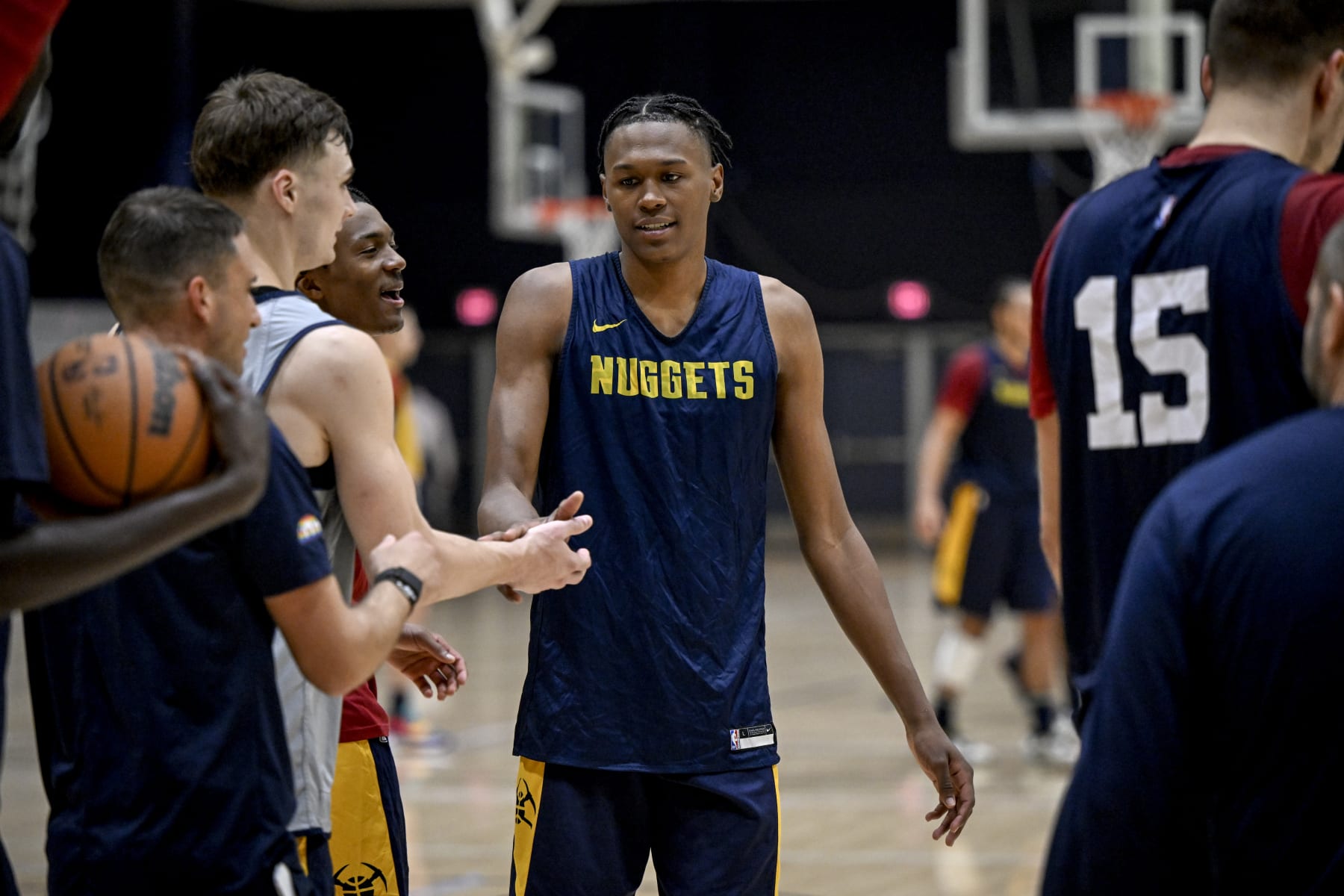 LA JOLLA, CA - SEPTEMBER 29: Denver Nuggets forward Peyton Watson high fives teammates Christian Braun and Bones Hyland after their group won a team-wide shooting competition to close practice during the teams training camp at the UCSD campus in La Jolla, California on Thursday, September 28, 2022. (Photo by AAron Ontiveroz/MediaNews Group/The Denver Post via Getty Images)